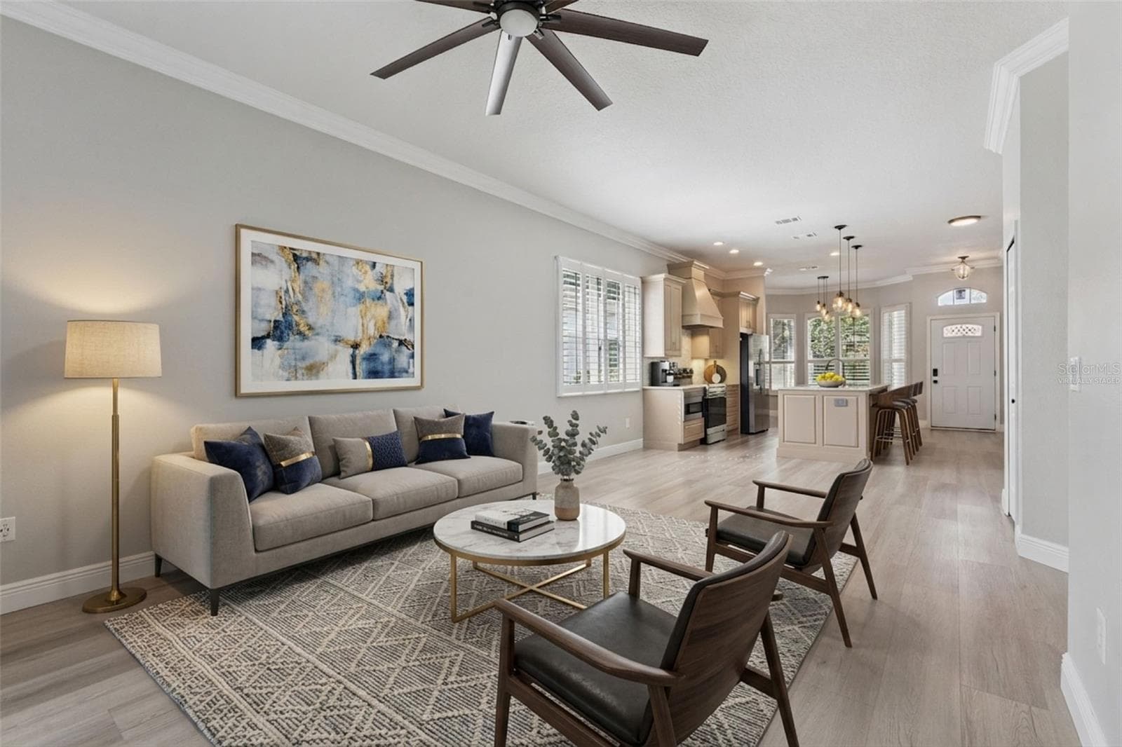 Virtually Staged. Family room/ Kitchen combo is great for entertaining or just bringing the family together.  Lots of natural light in this space! - 1206 CHESSINGTON CIR, LAKE MARY