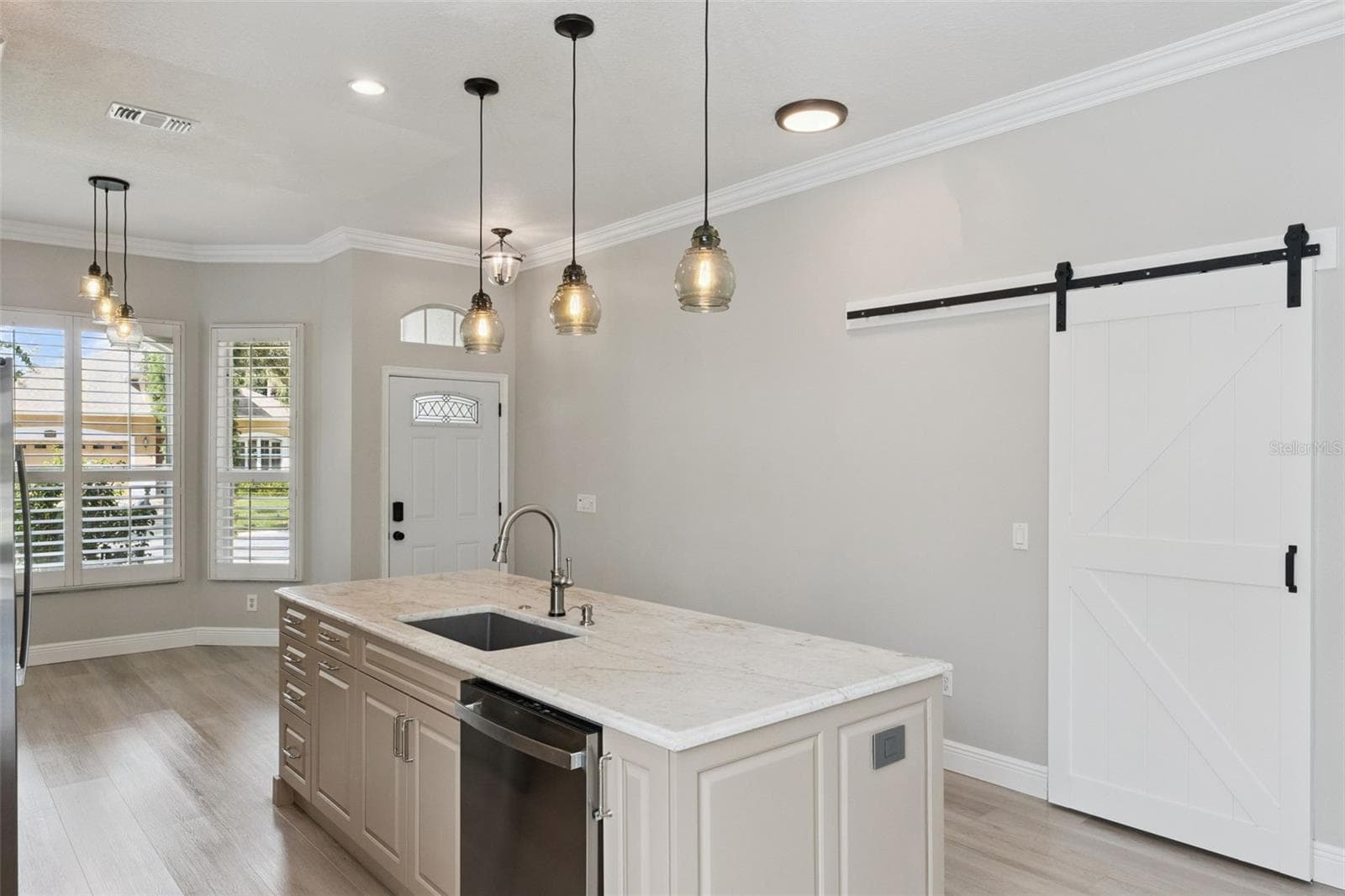 Barn door opens to laundry room - 1206 CHESSINGTON CIR, LAKE MARY