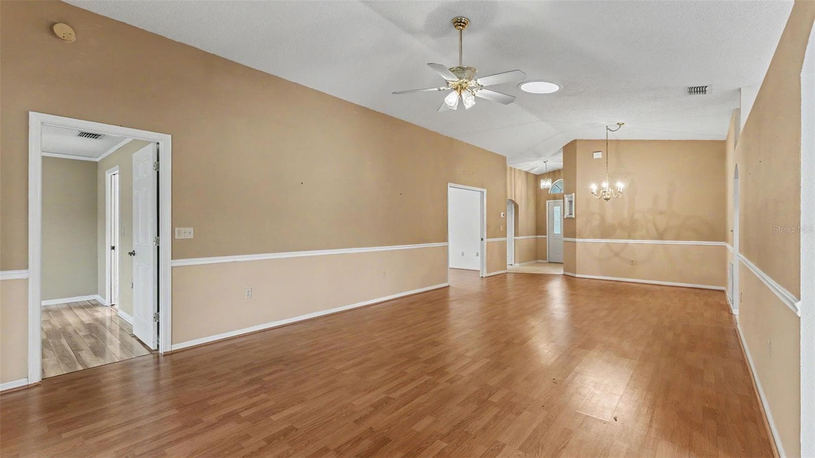 Living room, entry way, and dining room - 2191 SILVER RE DR, LAKELAND
