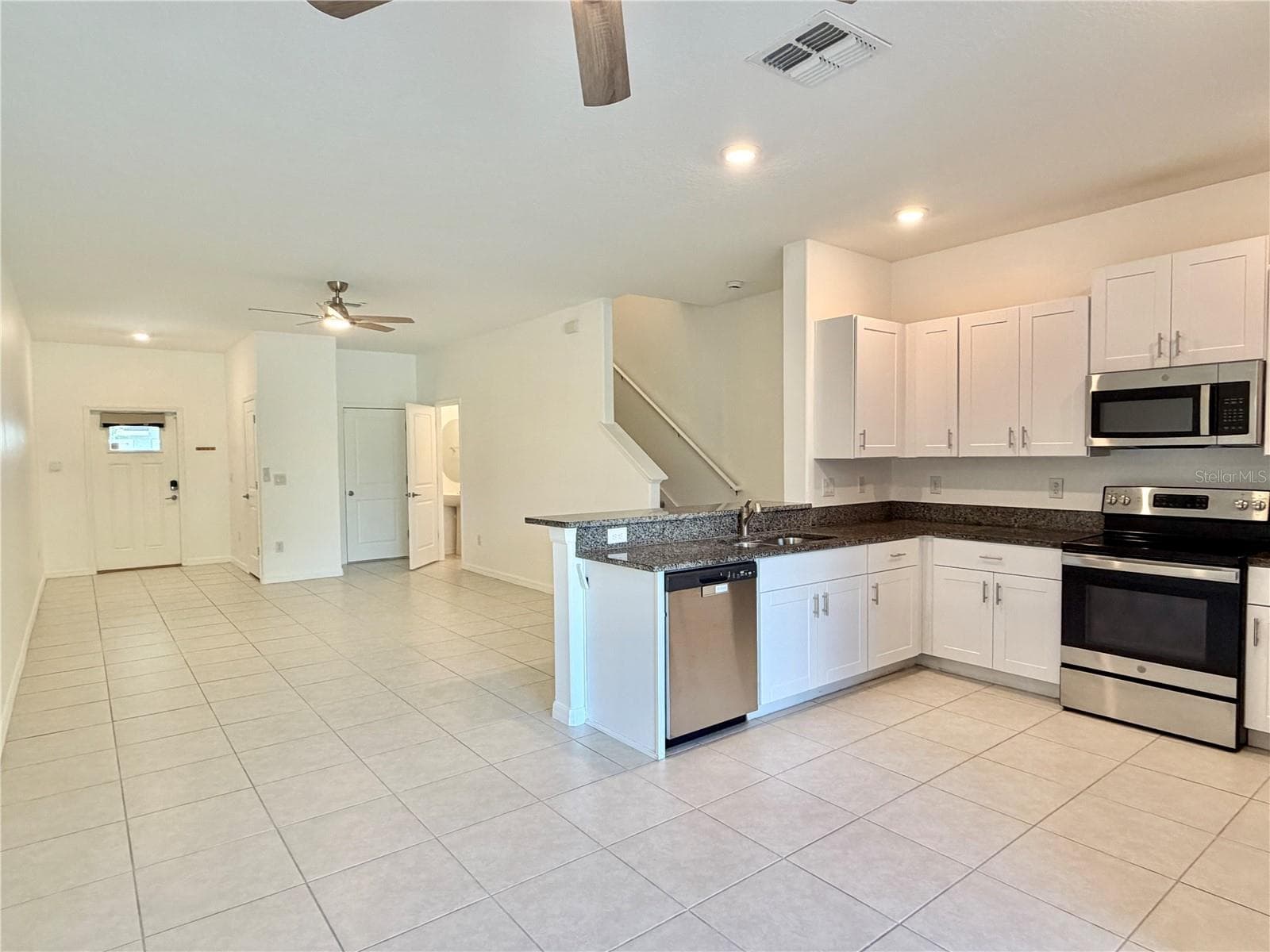 Dining into living room - 2578 CHARLAN CT, HOLIDAY