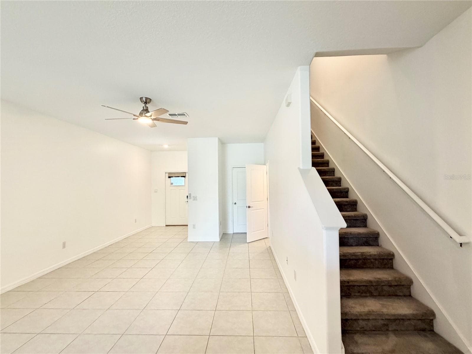 Living room and stairs - 2578 CHARLAN CT, HOLIDAY