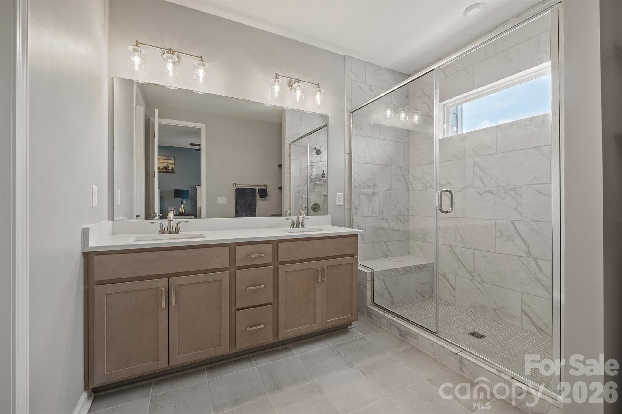 Primary bathroom with quartz countetop and tiled shower surround - 6161 Pierce Lane, Kannapolis