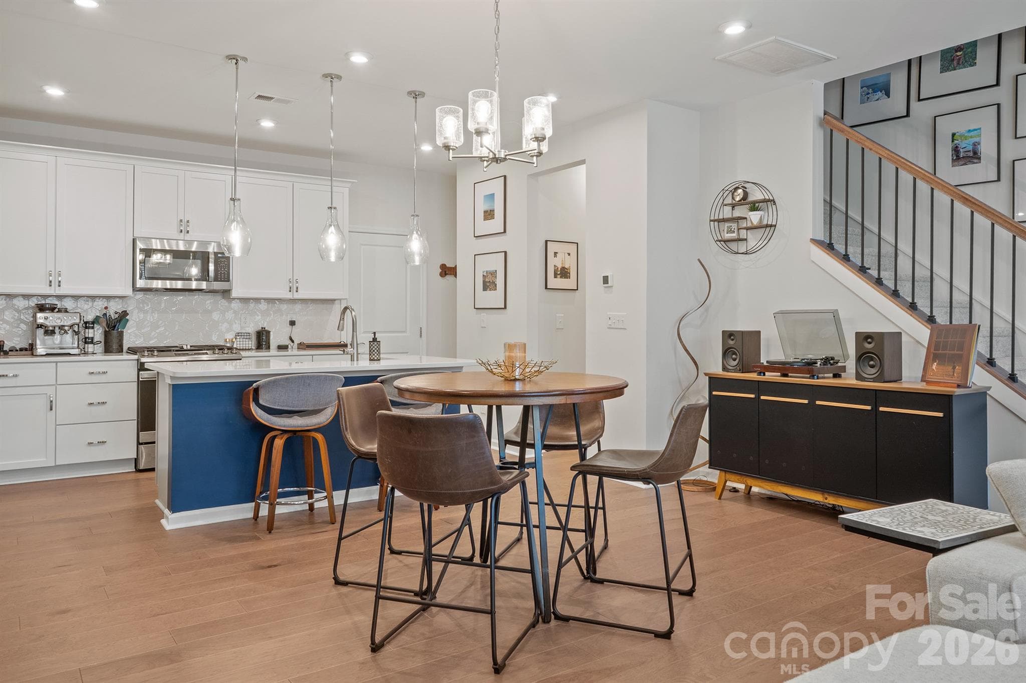 Dining area and kitchen with beautiful hardwood floors - 6161 Pierce Lane, Kannapolis
