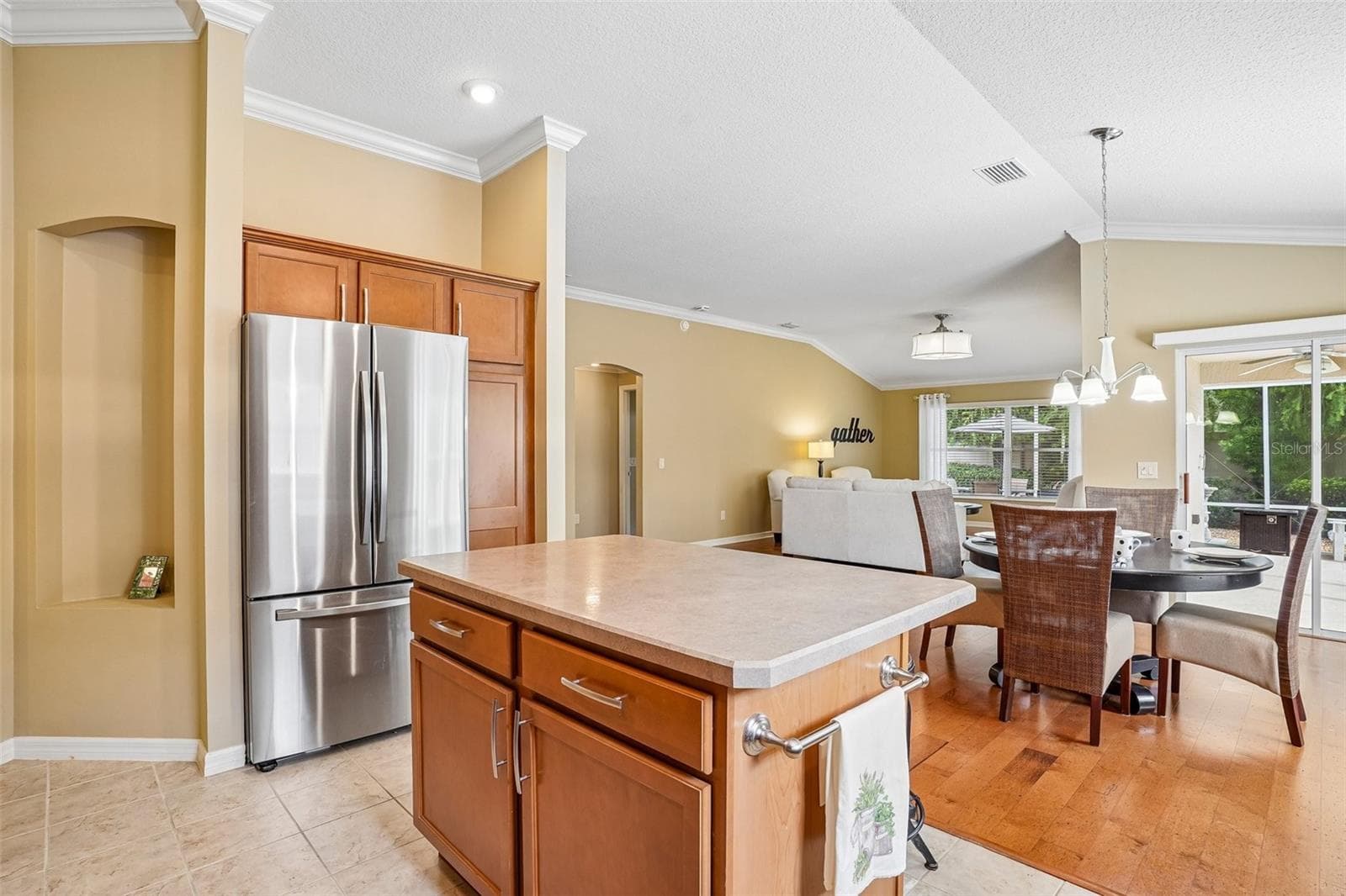 Kitchen Island into Dining Room - 583 ARTEAGA WAY, THE VILLAGES