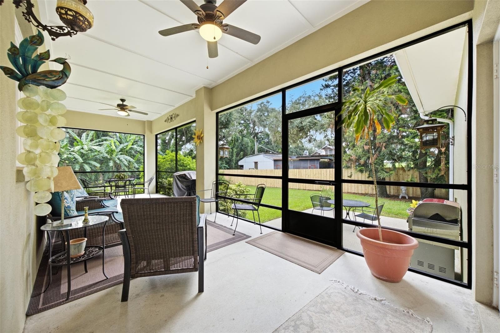 Screened rear porch under roof. - 1905 PINE ST, VALRICO
