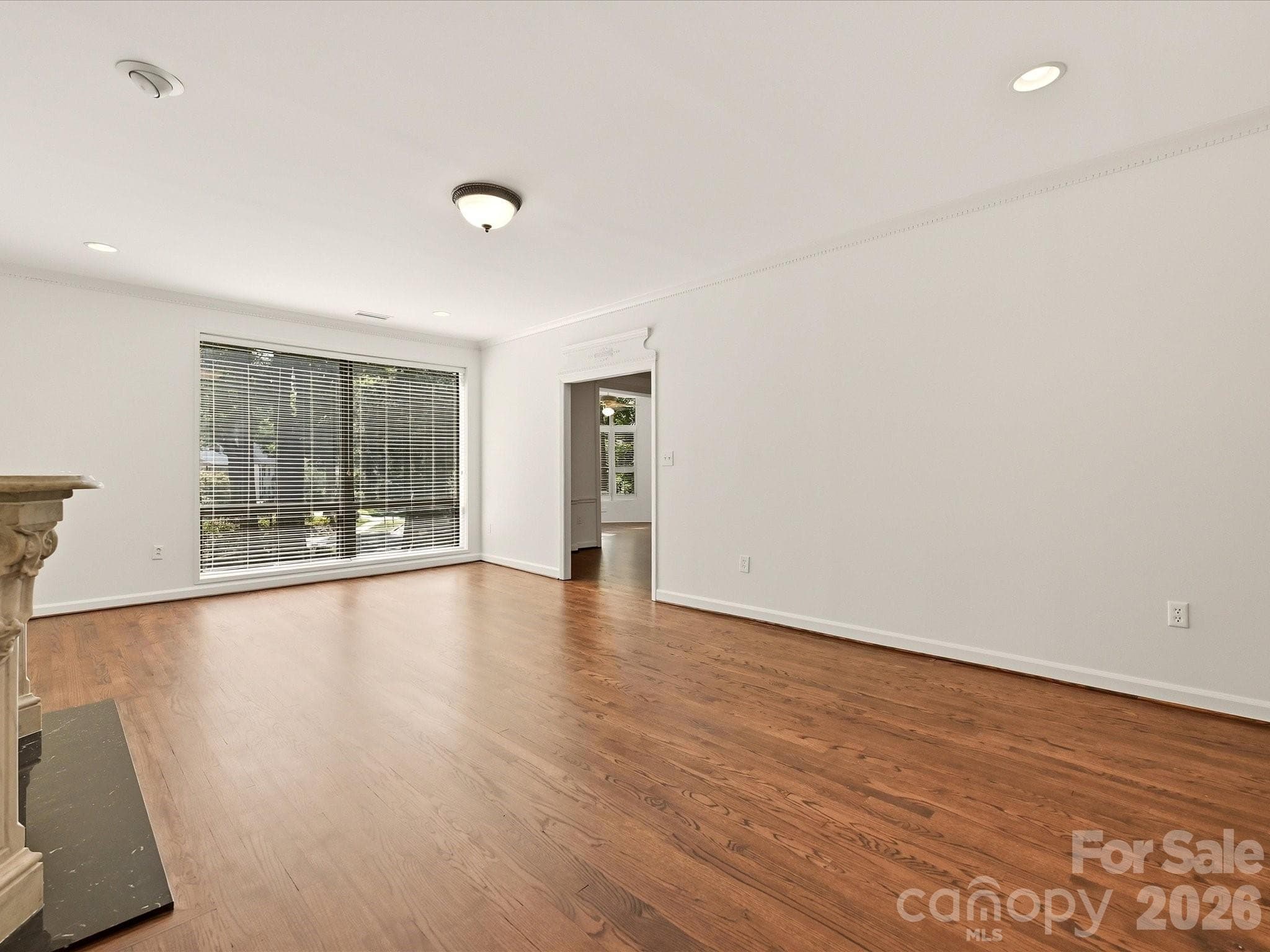 Oversized windows show off the gleaming hardwood floors - 806 Cherokee Road, Charlotte