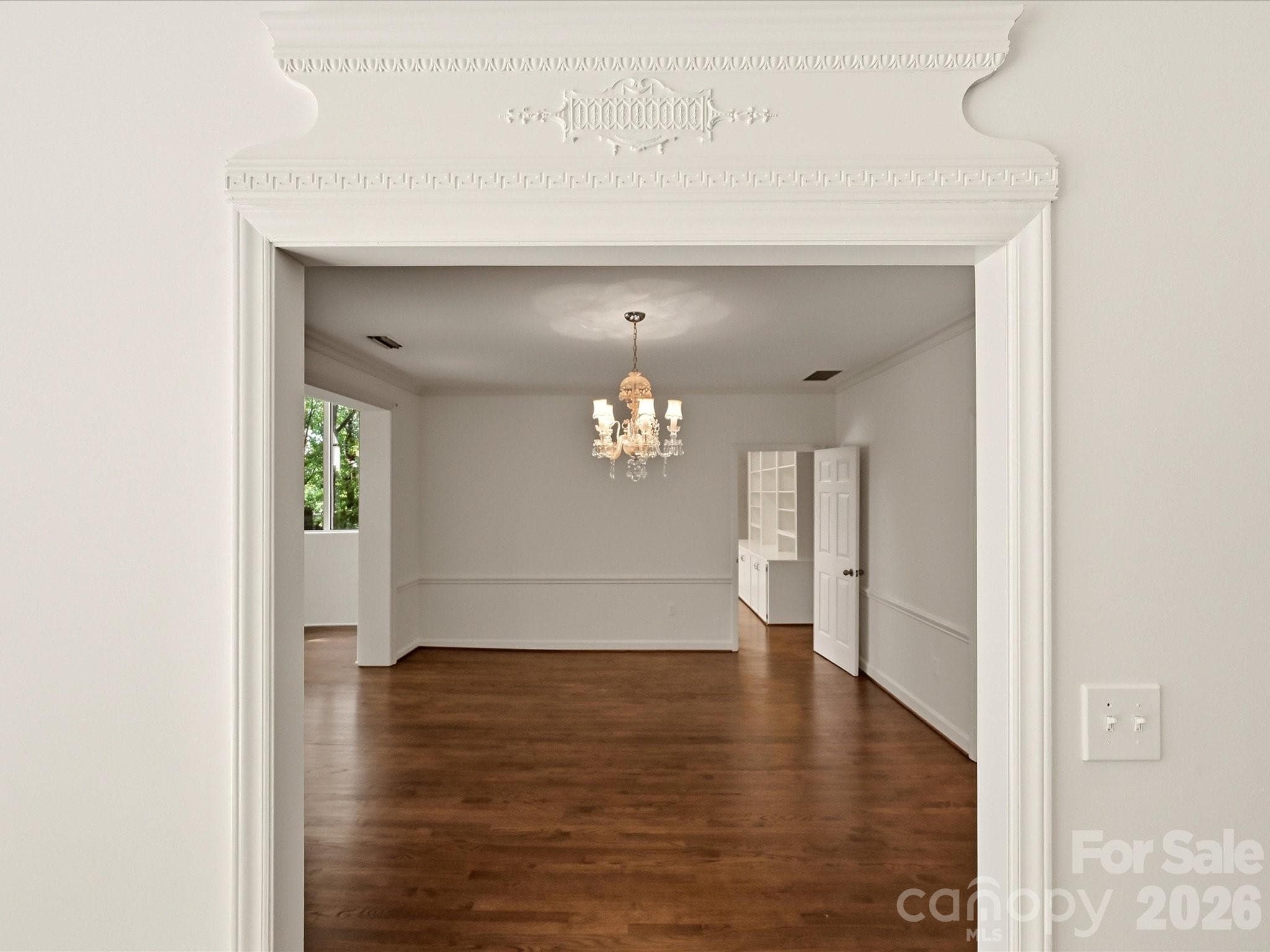 Architectural detail over the living room entrance to the dining room - 806 Cherokee Road, Charlotte