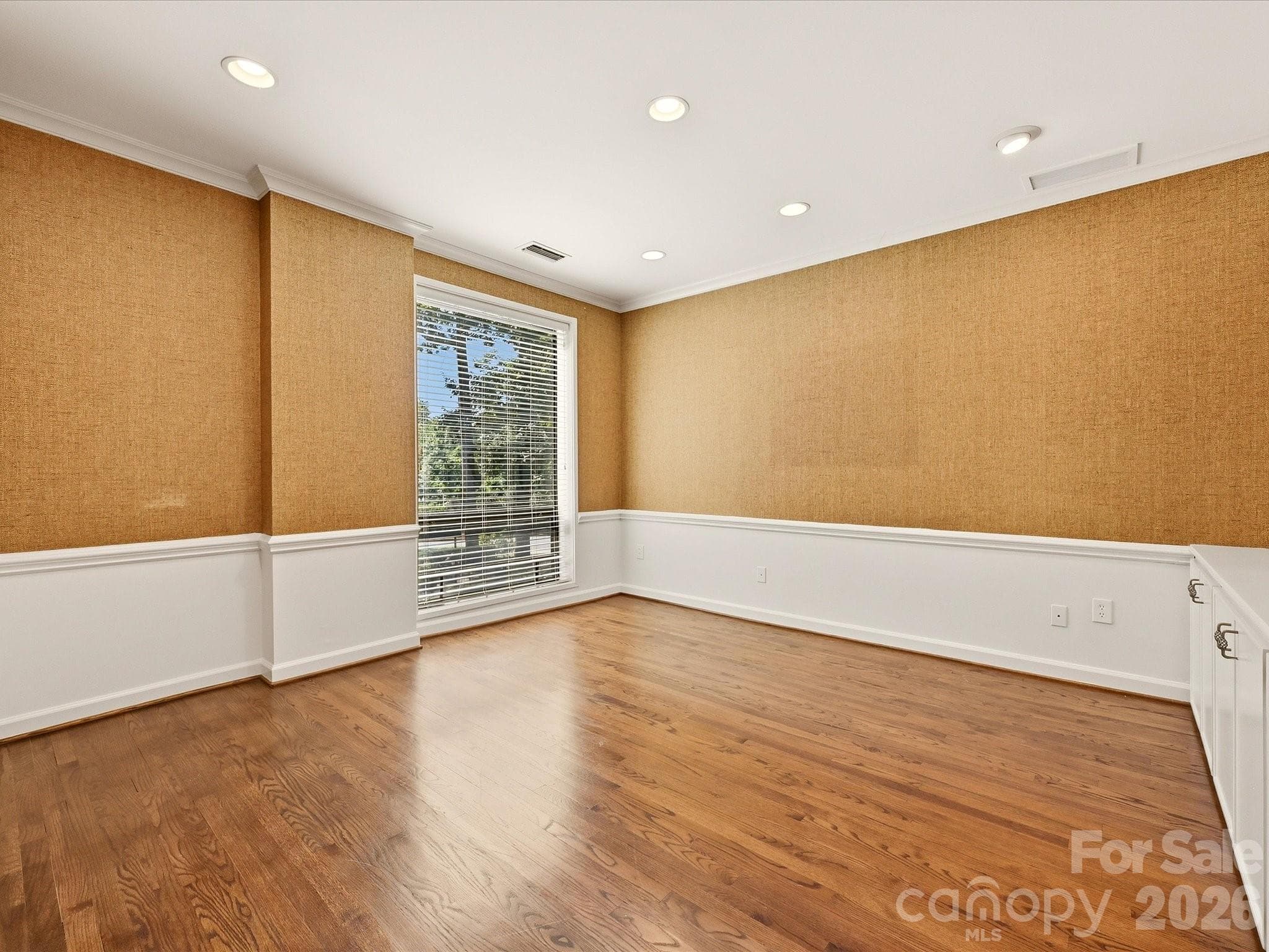 Den with handsome grasscloth wallpaper - 806 Cherokee Road, Charlotte