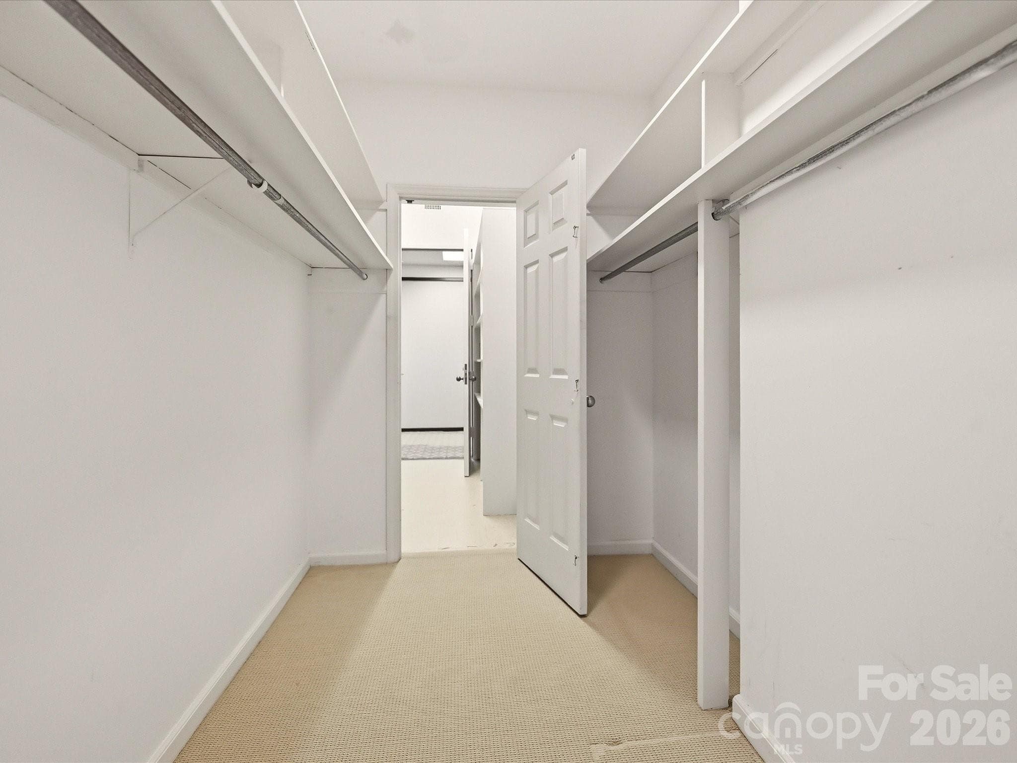 Closet opens to storage unit with an exterior door to the hall. - 806 Cherokee Road, Charlotte