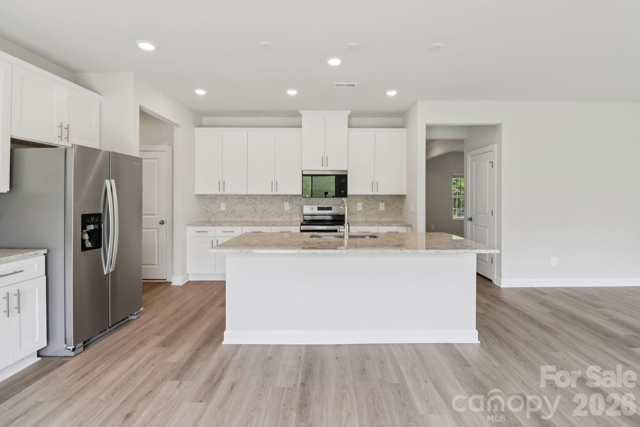 Photo is not of the actual home but is an inspirational photo of builder’s model home and may depict options, furnishings, and/or decorator features that are not included. - 2310 Snapdragon Court, Stanley