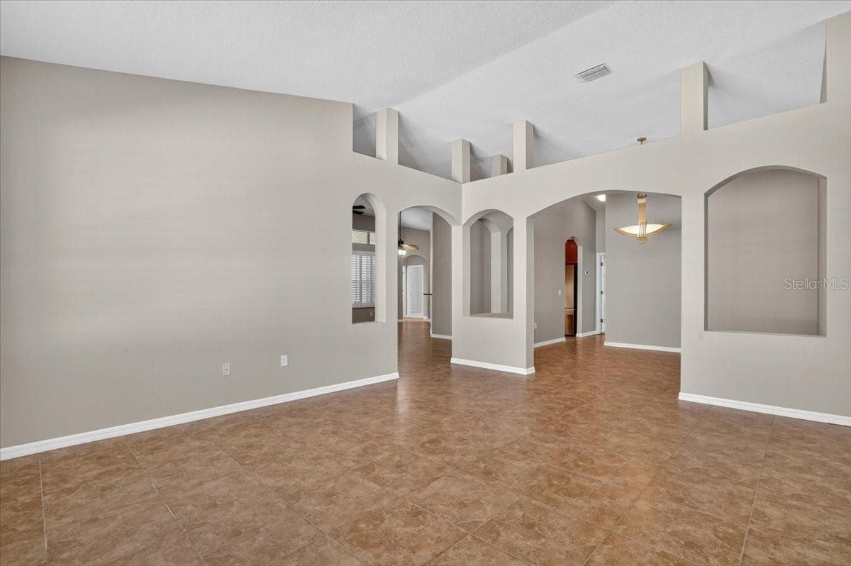 Living room looking at dining room - 2309 SWORDFISH AVE, HOLIDAY