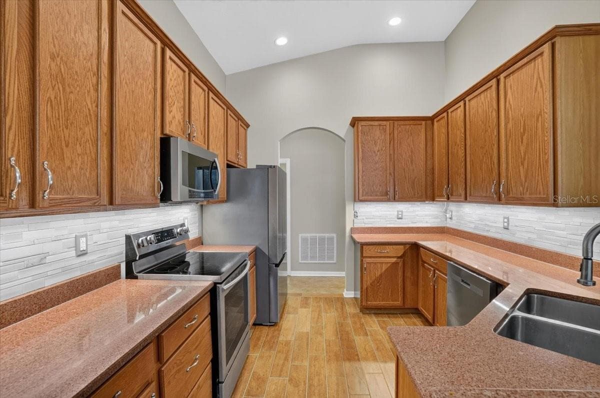 Kitchen with stainless steel appliances - 2309 SWORDFISH AVE, HOLIDAY