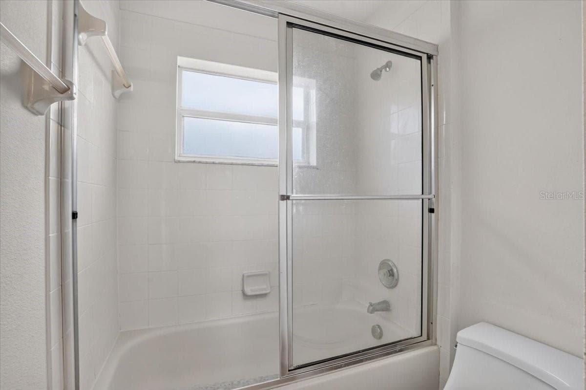Jack and Jill bathroom 2 - 2309 SWORDFISH AVE, HOLIDAY