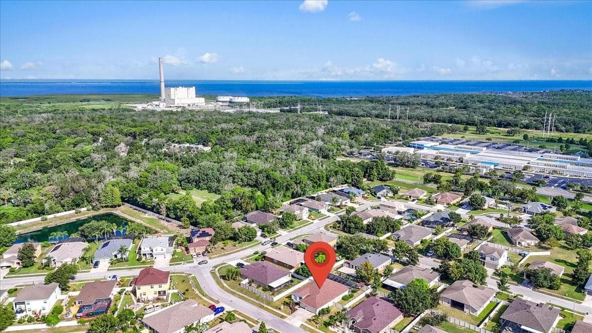 Drone view shows close proximity to the Gulf Of America and the Anclote river proximity that goes by the Duke electrical power plant - 2309 SWORDFISH AVE, HOLIDAY