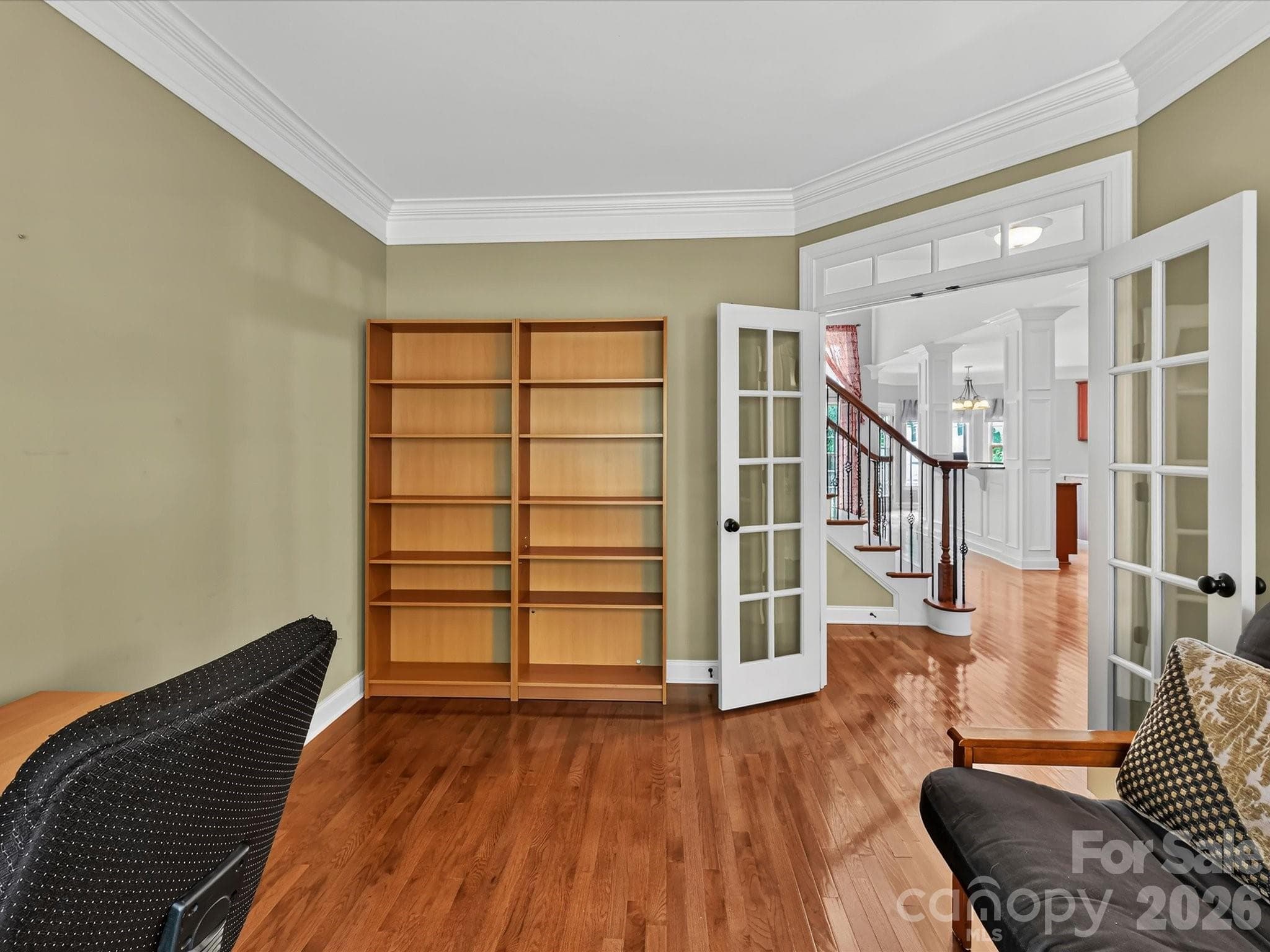 French doors open to a versatile main-level flex space, ideal for a home office, study, or sitting room. - 11203 Warfield Avenue, Huntersville