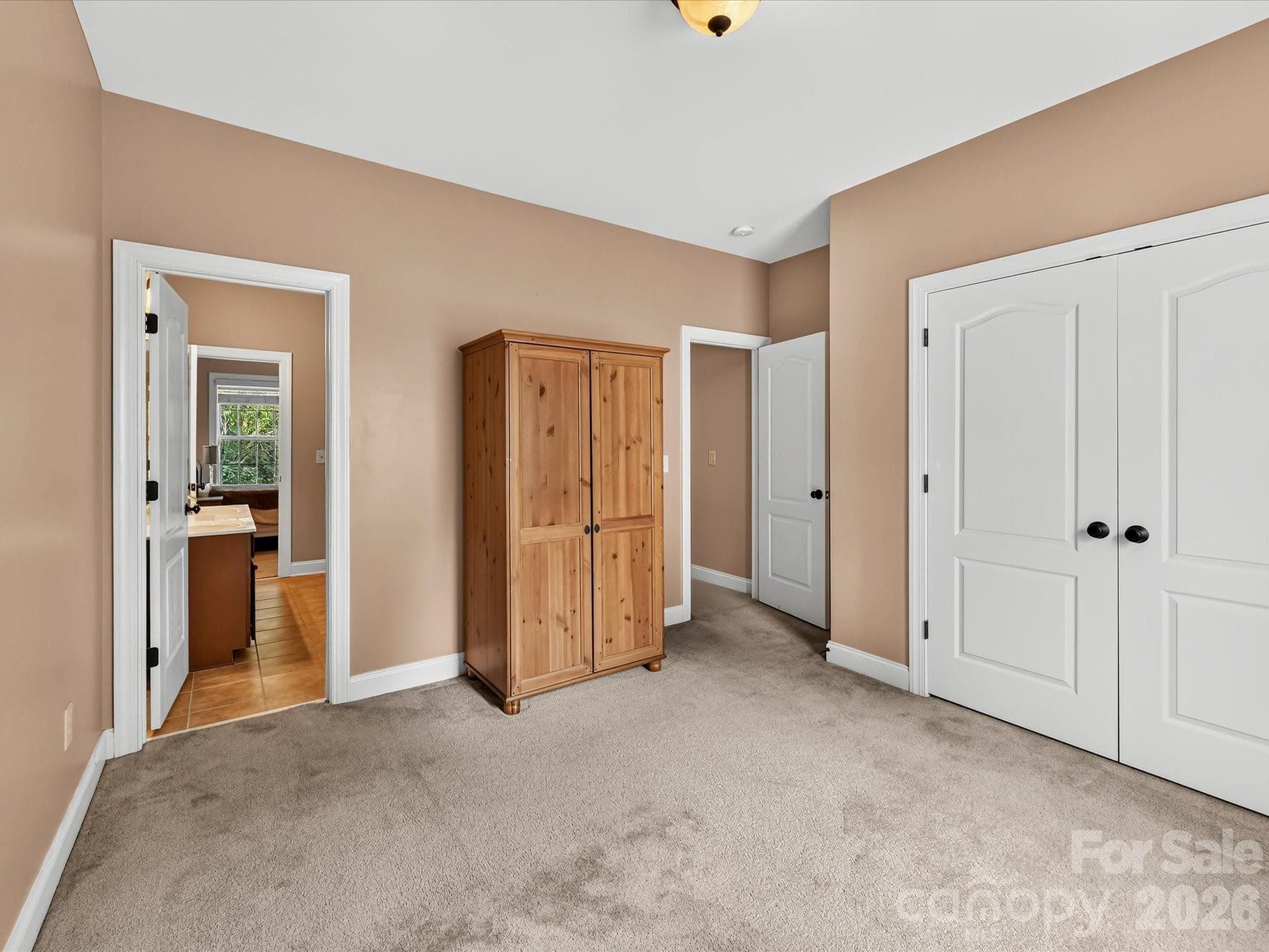 Additional bedroom provides versatile space for guests, family, a home office, or hobby room. - 11203 Warfield Avenue, Huntersville