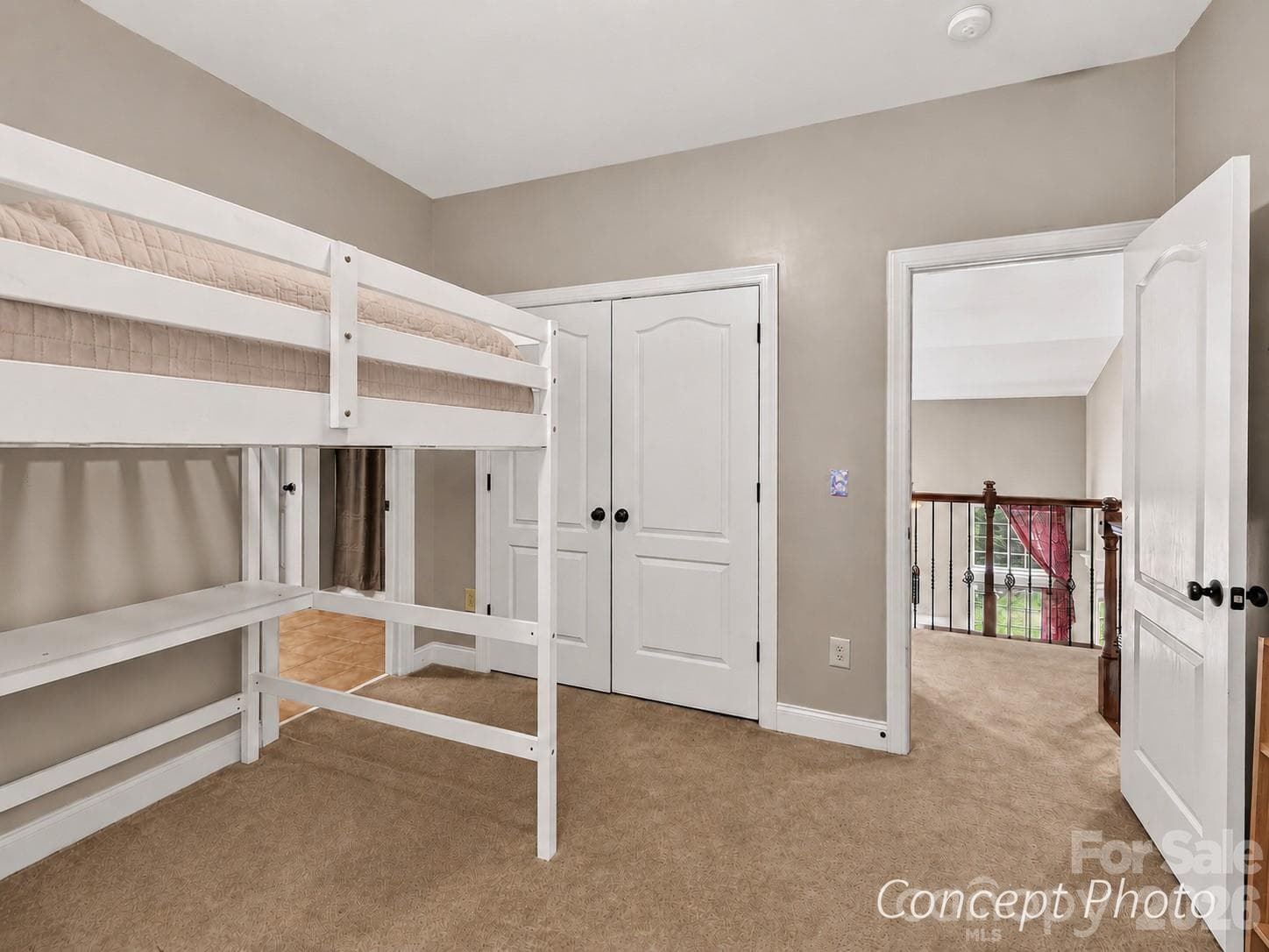 Spacious secondary bedroom offers flexible furniture placement, generous closet space, and convenient bathroom access. - 11203 Warfield Avenue, Huntersville