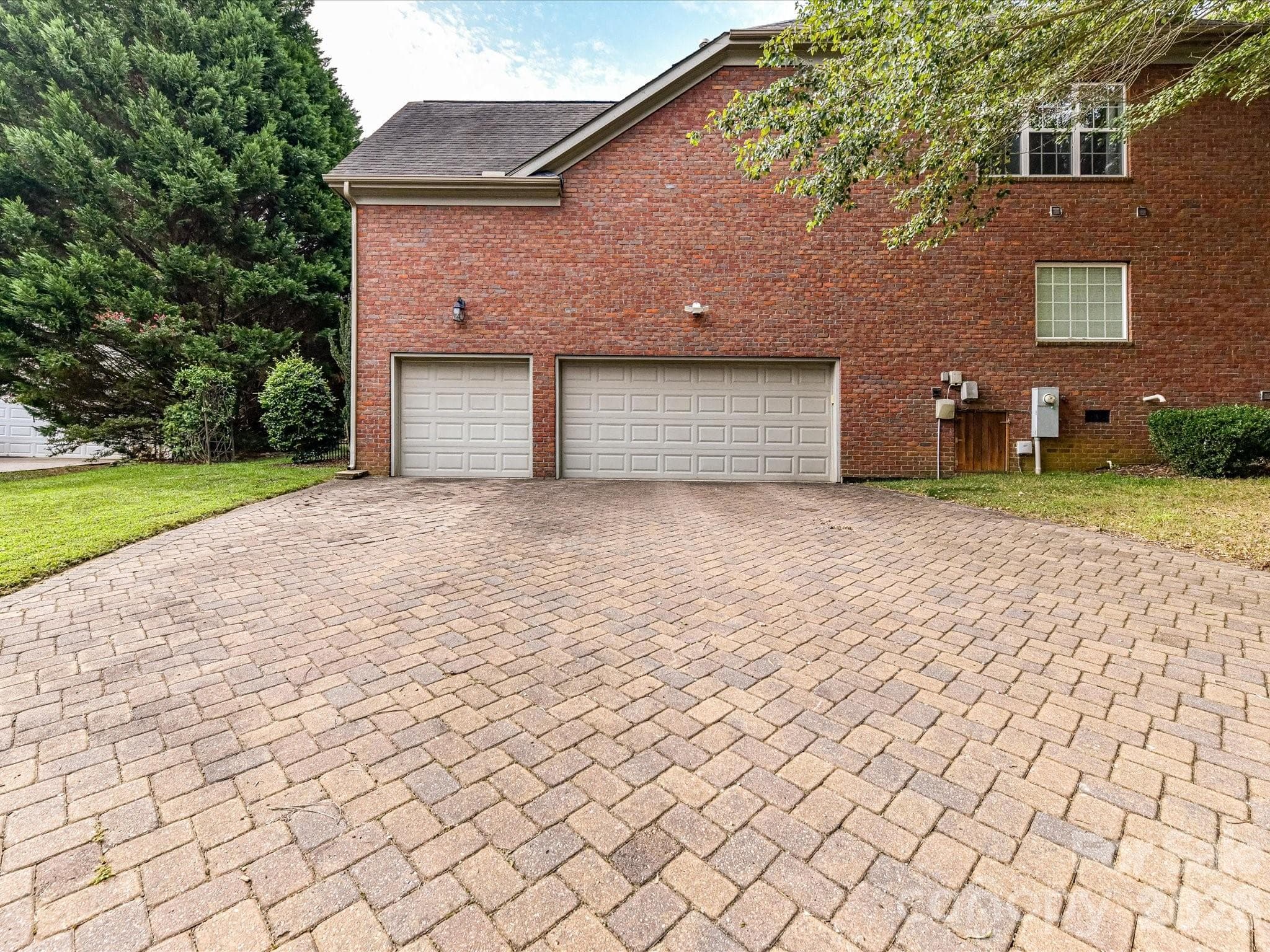 Expansive three-car garage provides abundant parking, storage, and everyday functionality. - 11203 Warfield Avenue, Huntersville