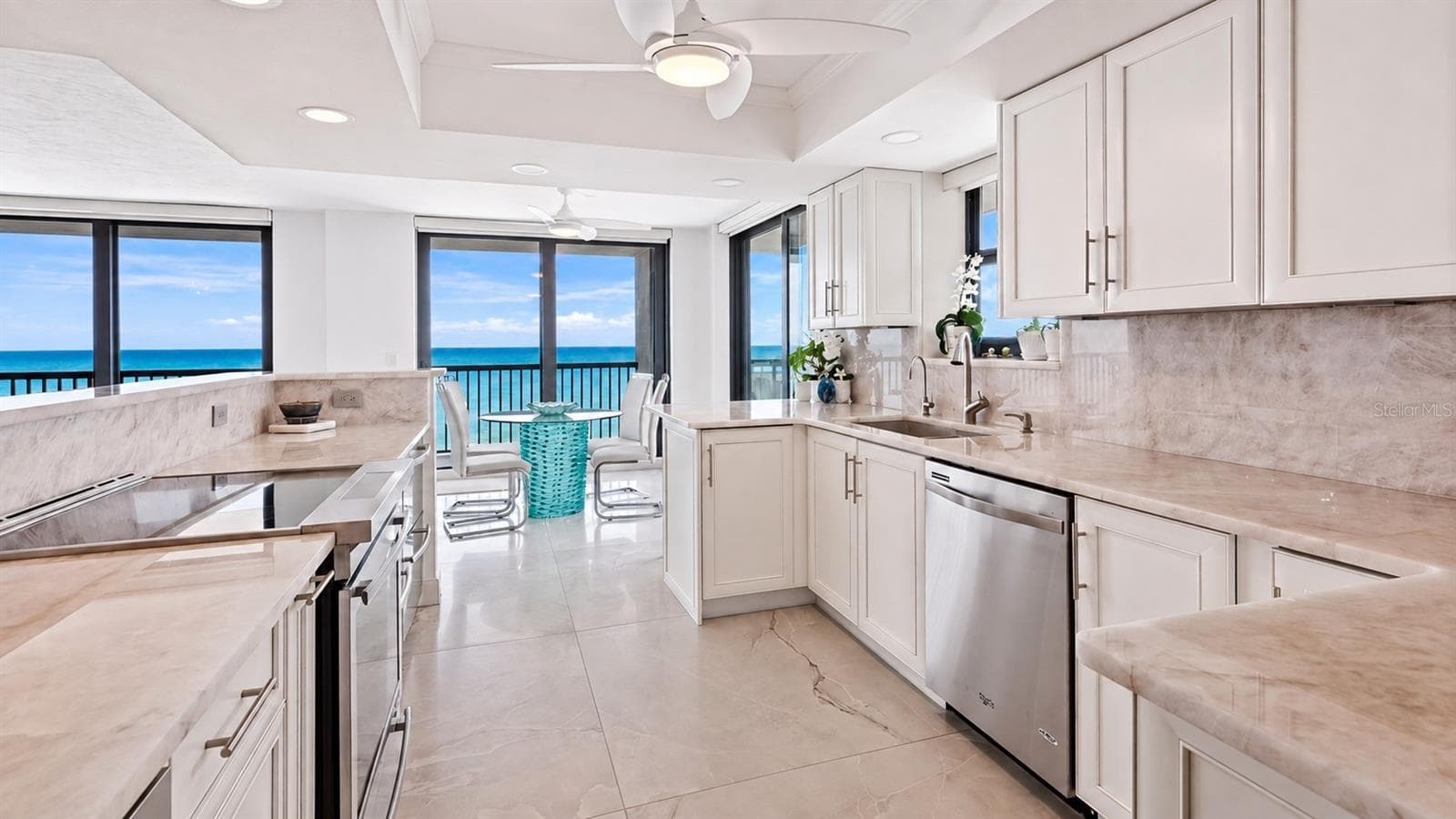 Enough space to prepare a good meal while you take in the spectalcular views. The butler's pantry is steps away with an extra fridge and lots of storage space. - 1660 GULF BLVD #PH1, CLEARWATER BEACH
