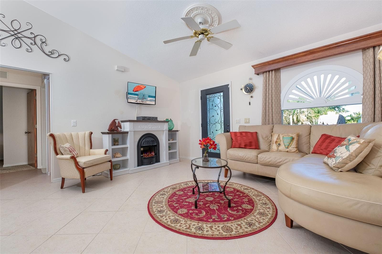 Electric fireplace in living room - 9296 ARRID CIR, PORT CHARLOTTE