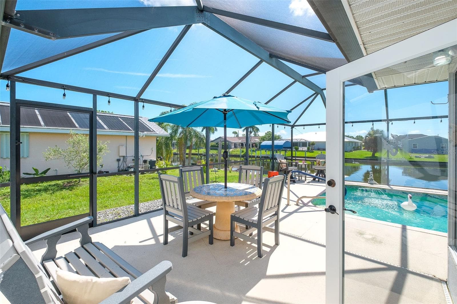 Lanai & pool entry off FL room - 9296 ARRID CIR, PORT CHARLOTTE