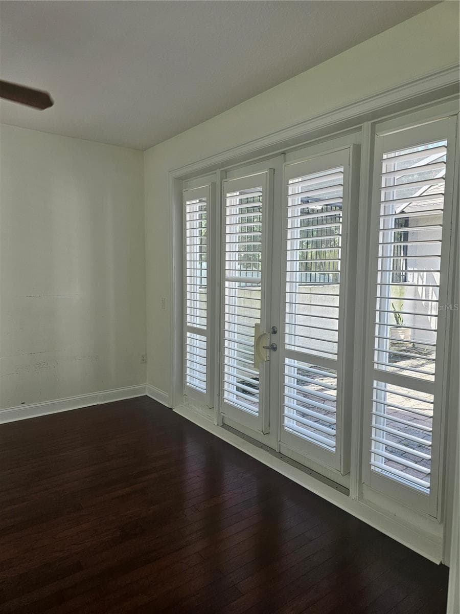 Thhird Bedroom double doors leading to the courtyard - 33116 IRONGATE DR, LEESBURG