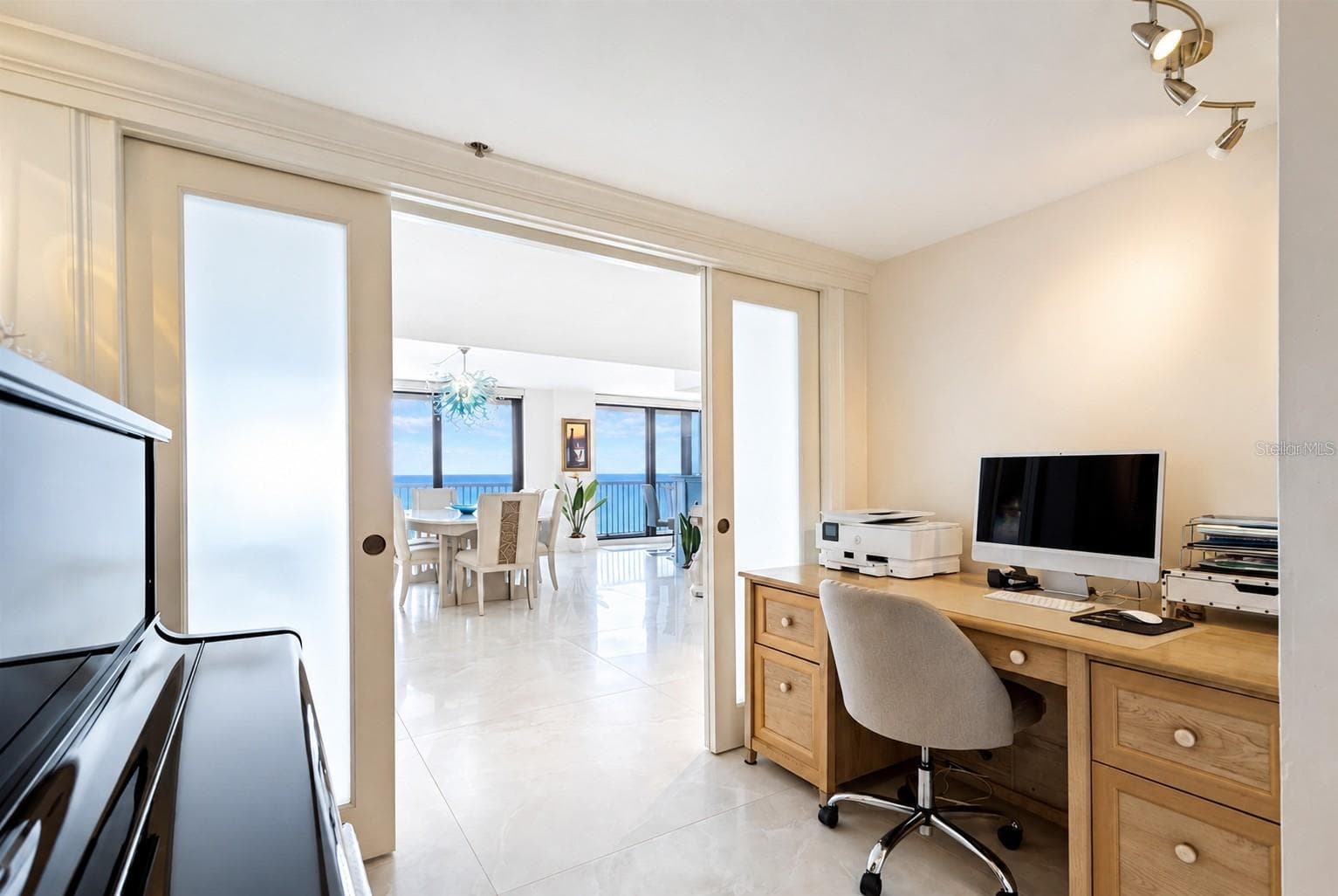 The sitting area is cozy enough to relax in but large enough to comfortably accomodate a piano and a large desk...sometimes work beckons! - 1660 GULF BLVD #PH1, CLEARWATER BEACH