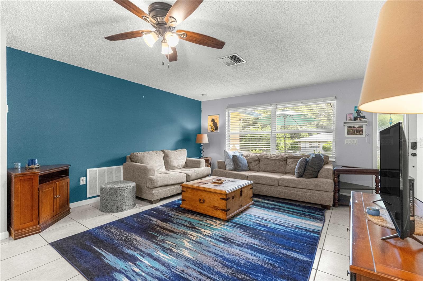 Another living-room view shows the connection to the dining area. - 2170 W DORAL CT, CITRUS SPRINGS