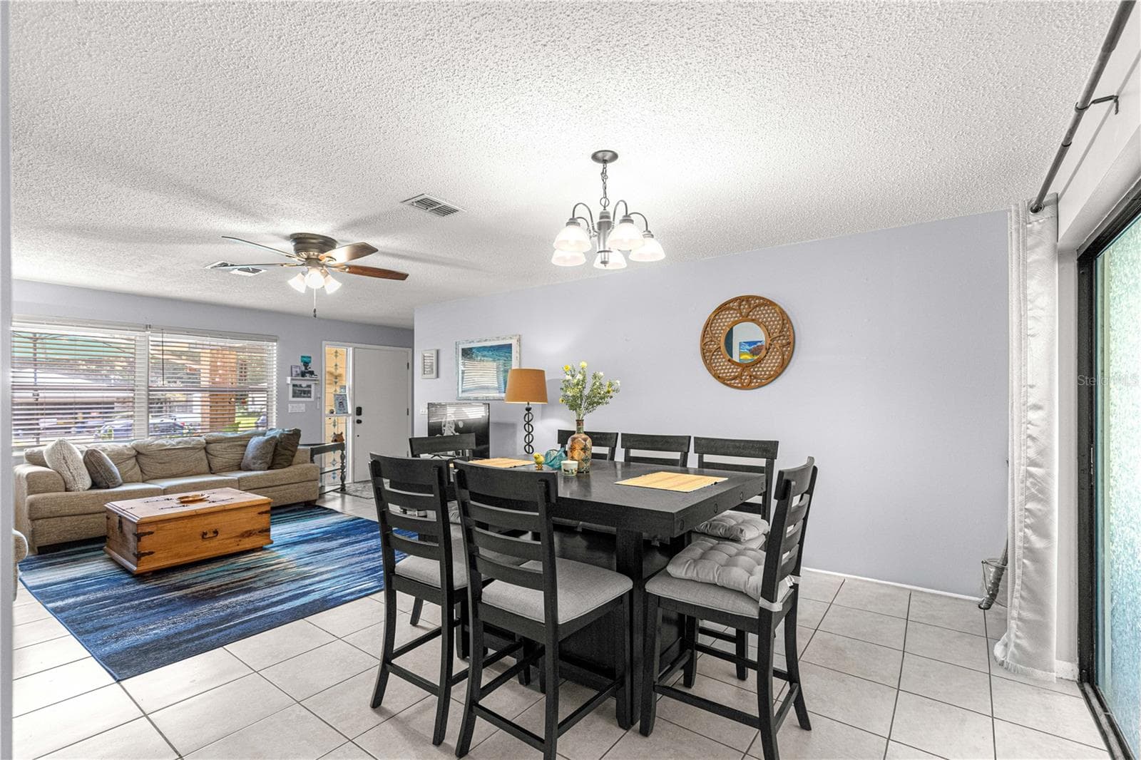 Connected living and dining areas provide flexible space for everyday use and entertaining. - 2170 W DORAL CT, CITRUS SPRINGS