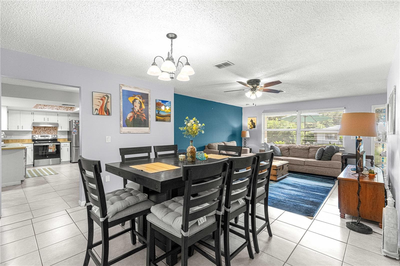 View from the dining area toward the living room and adjacent kitchen. - 2170 W DORAL CT, CITRUS SPRINGS
