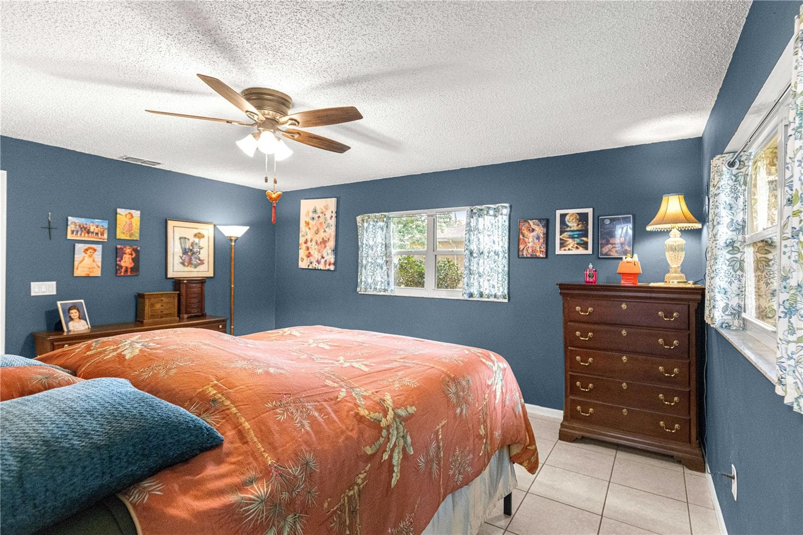 Primary bedroom with natural light and a ceiling fan. - 2170 W DORAL CT, CITRUS SPRINGS