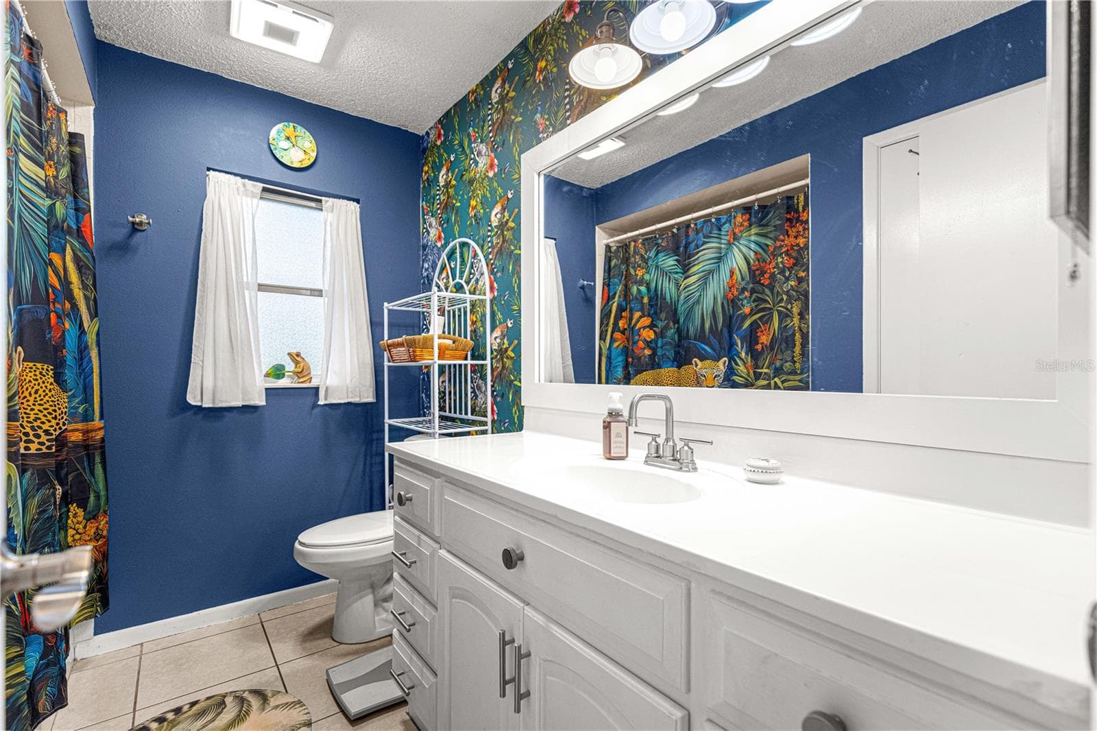 Another view of the second bathroom highlights the vanity and cabinet storage. - 2170 W DORAL CT, CITRUS SPRINGS