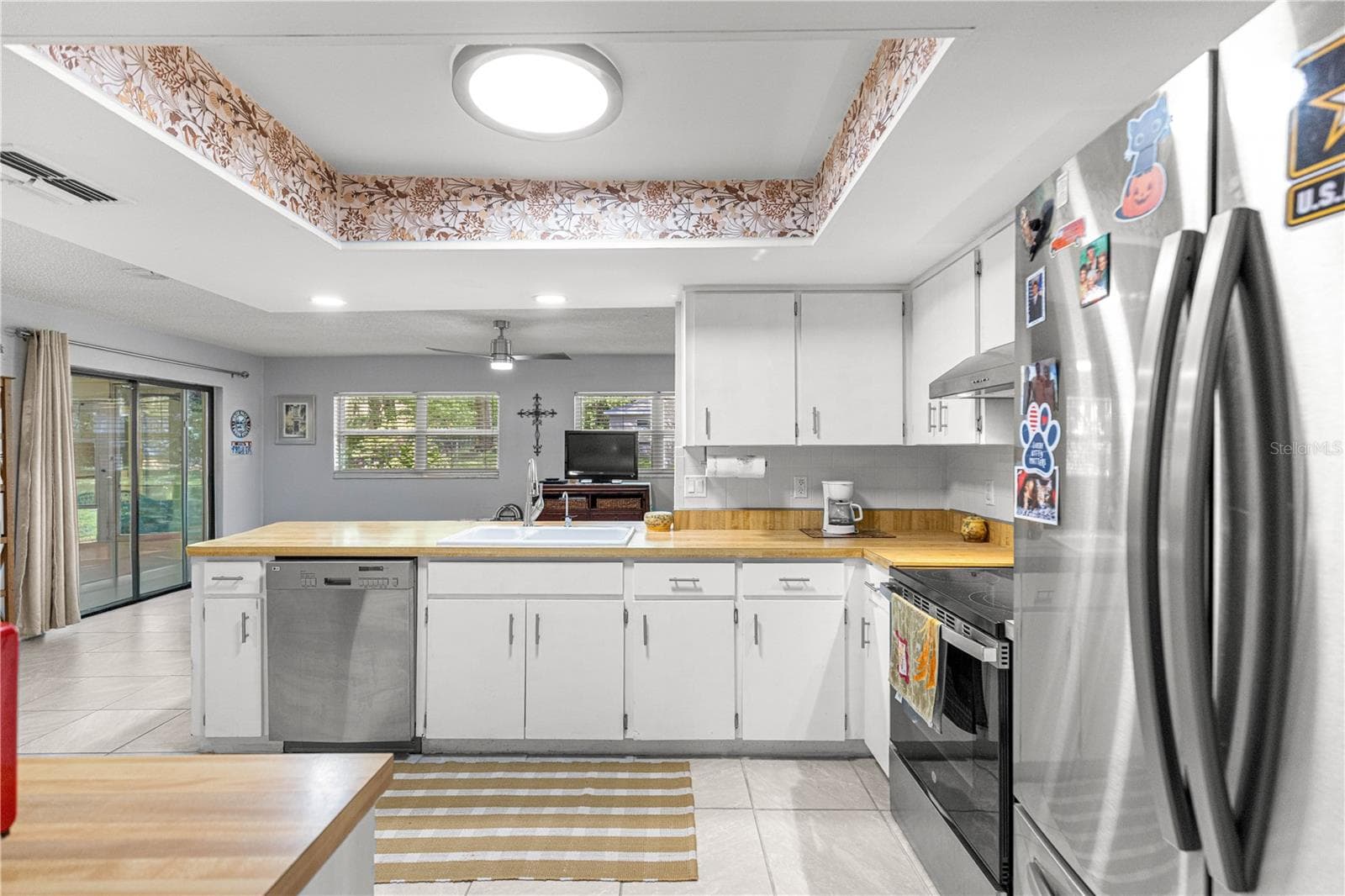 Kitchen sink beneath a wide window, with counter space on either side. - 2170 W DORAL CT, CITRUS SPRINGS