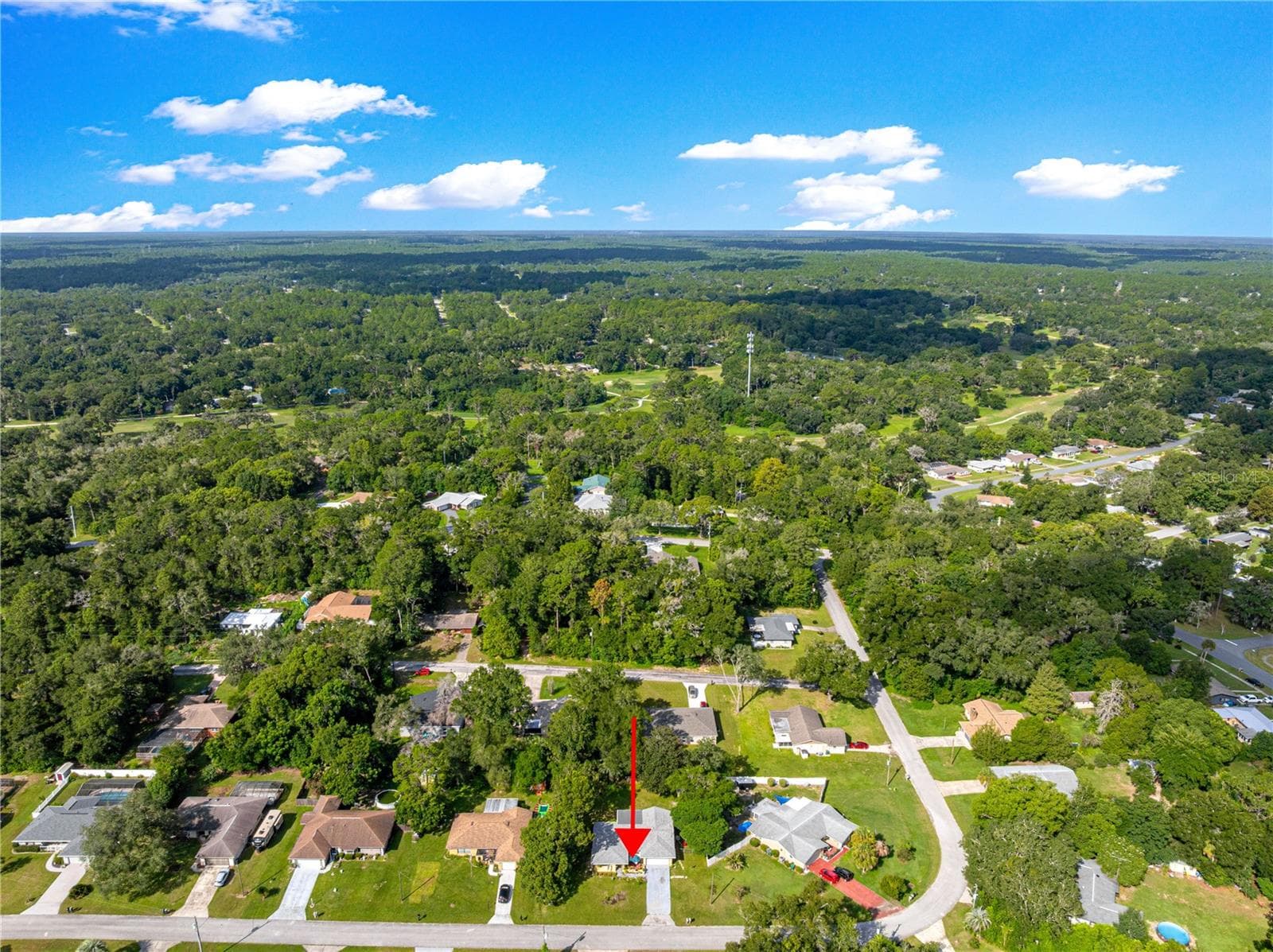 Aerial view showing nearby streets and established tree cover. - 2170 W DORAL CT, CITRUS SPRINGS