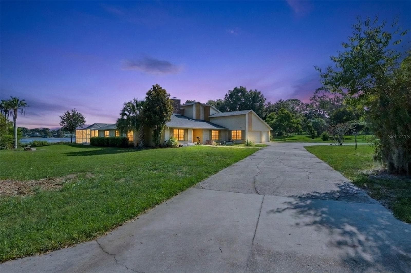 Welcome home to this beautiful lakefront retreat, offering peaceful water views, a spacious homesite, mature landscaping, and plenty of room to enjoy the Florida lifestyle. - 25 LAKEWOOD CSWY, WINTER HAVEN
