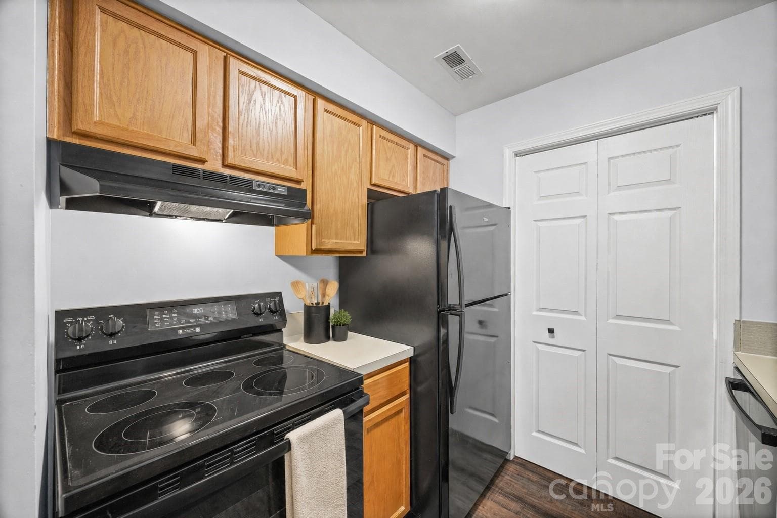 Kitchen with all new appliances including the refrigerator, washer, dryer - 8119 Tremaine Court, Charlotte