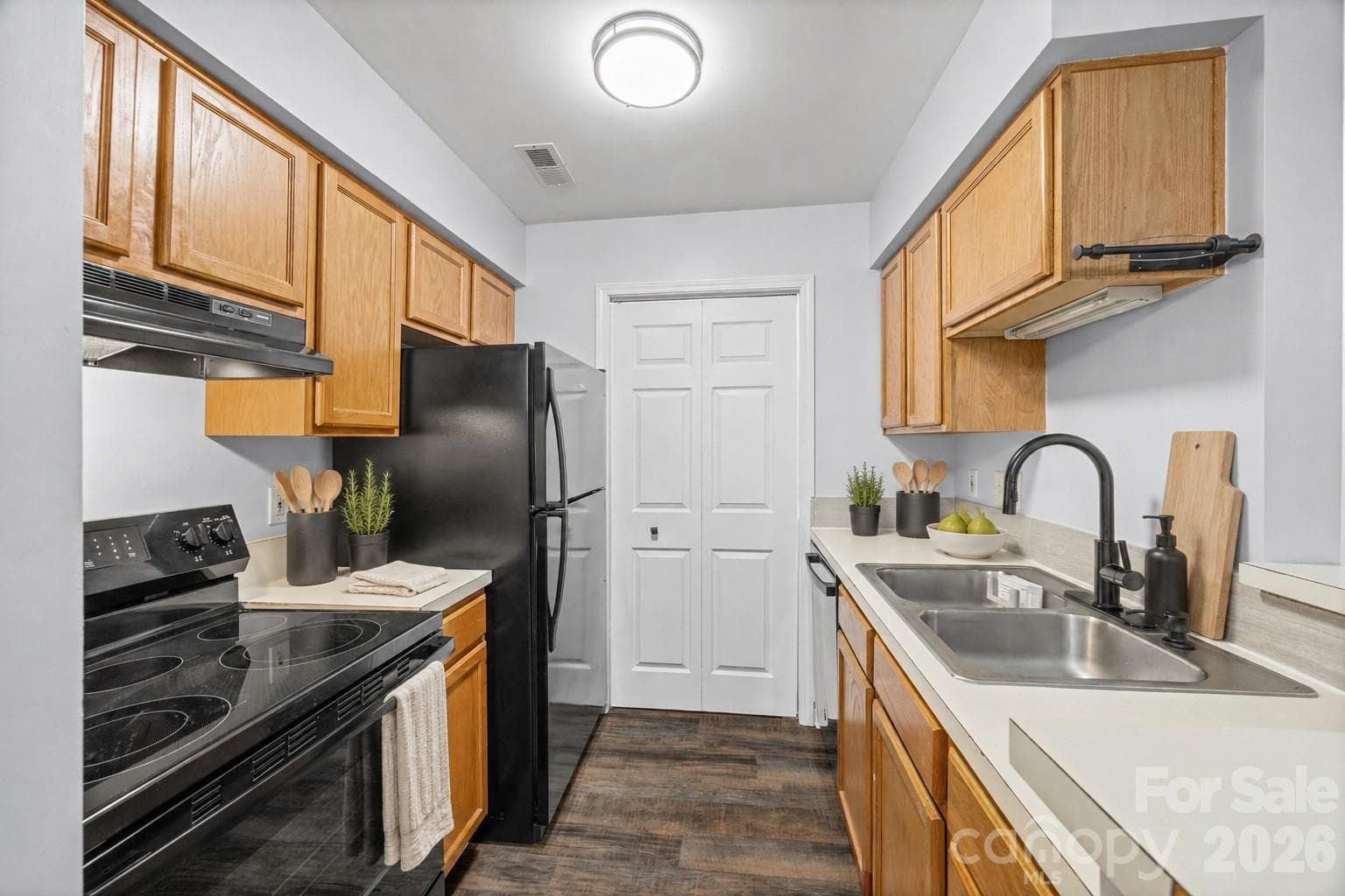 Kitchen with Laundry behind the door. - 8119 Tremaine Court, Charlotte