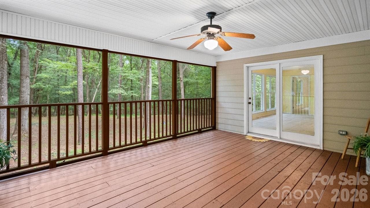 Screened in and Looking over .45 acre wooded yard. - 235 Withershinn Drive, Charlotte
