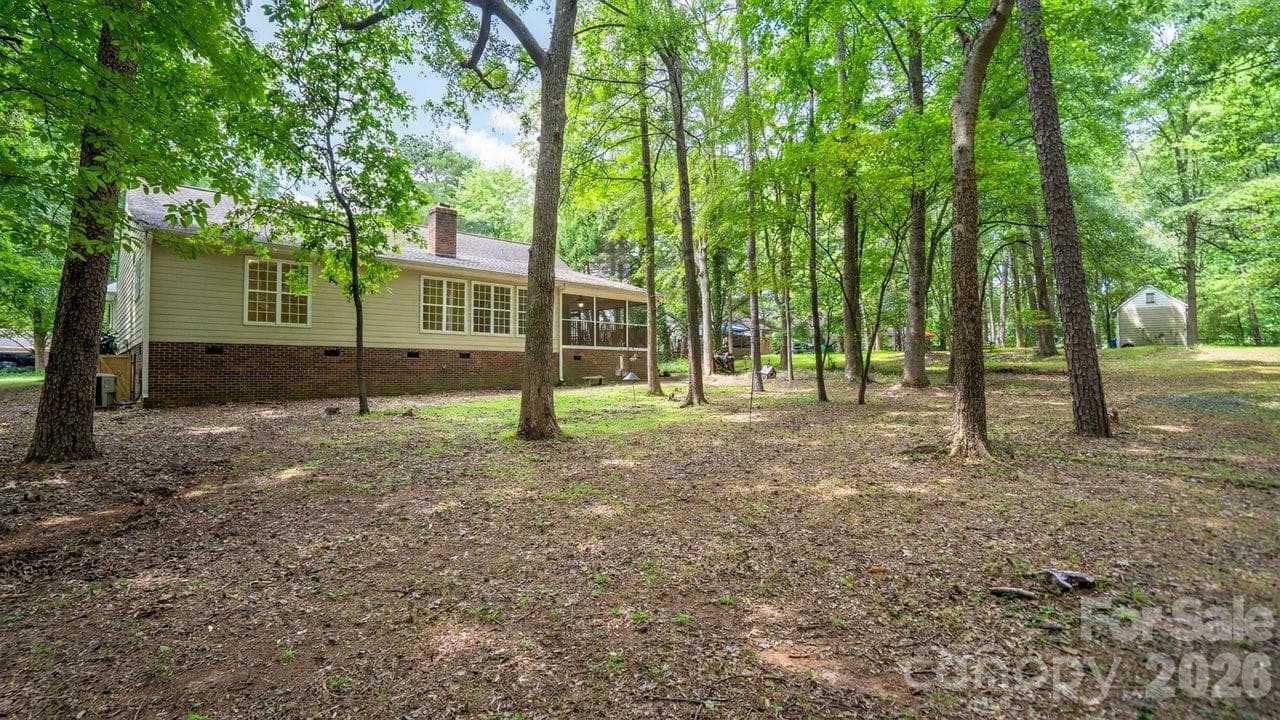 Private wooded lot, come see for yourself what this home has to offer. - 235 Withershinn Drive, Charlotte
