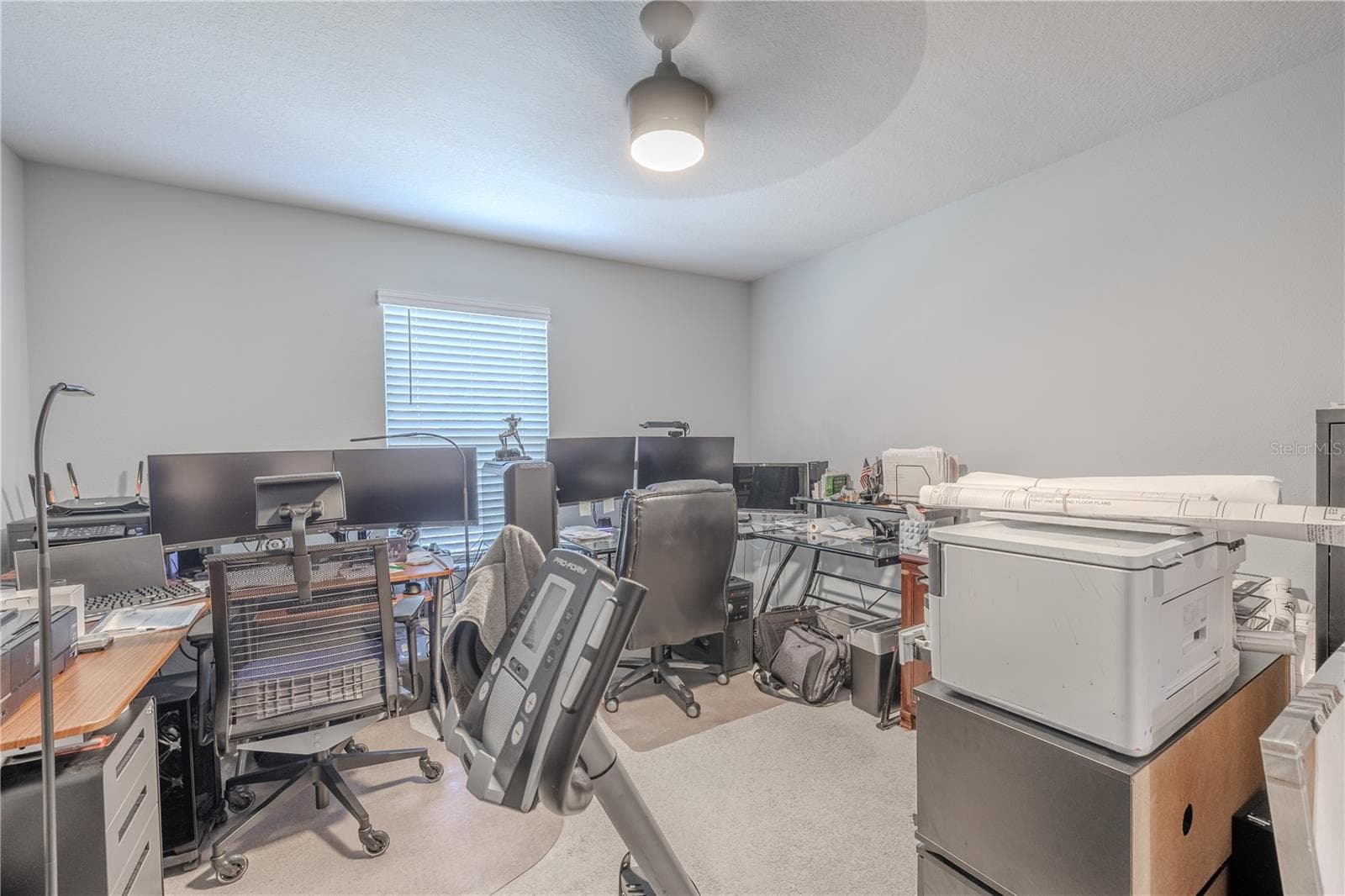 Bedroom 2 offers generous proportions, neutral carpet, a ceiling fan and natural light, with enough space for a full bedroom suite plus a desk, reading area or additional furniture. - 3029 JACOB CROSSING LN, HOLIDAY