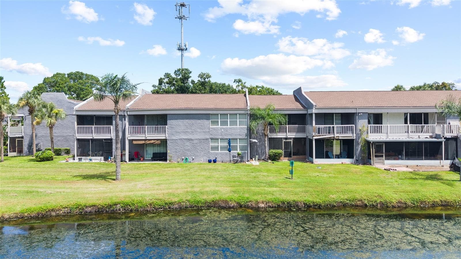 Building view from pond - 4038 CORTEZ DR #B, TAMPA