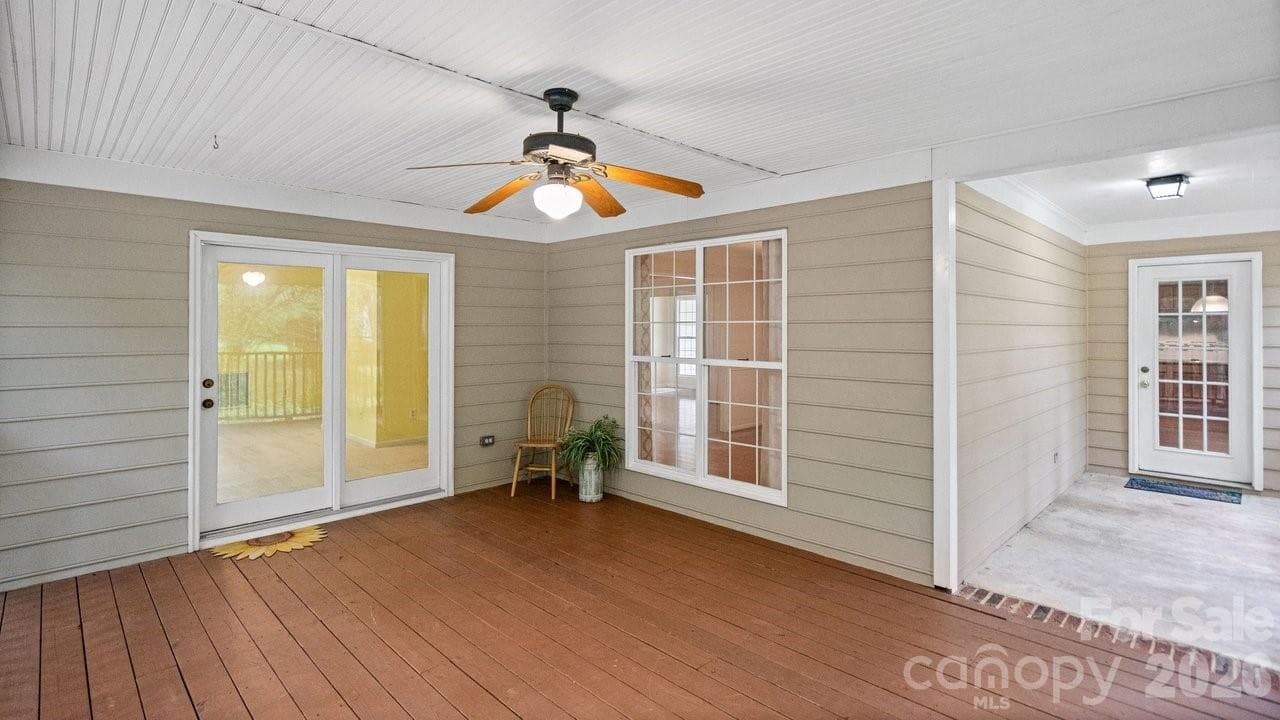 Covered, screened, and entrance to sunroom and kitchen - 235 Withershinn Drive, Charlotte
