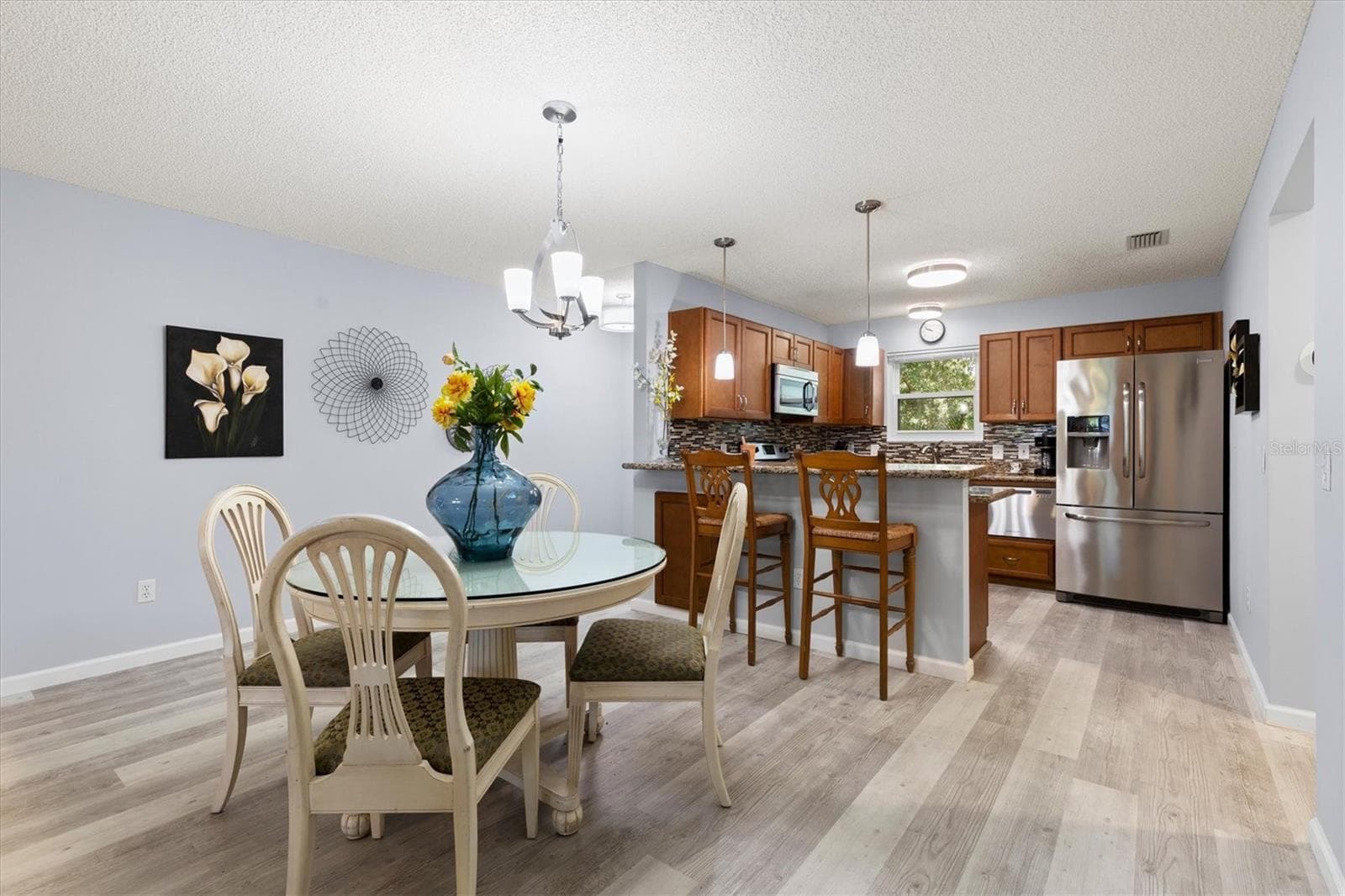 OPEN CONCEPT DINING AREA AND KITCHEN - 1426 JUAREZ PL, THE VILLAGES