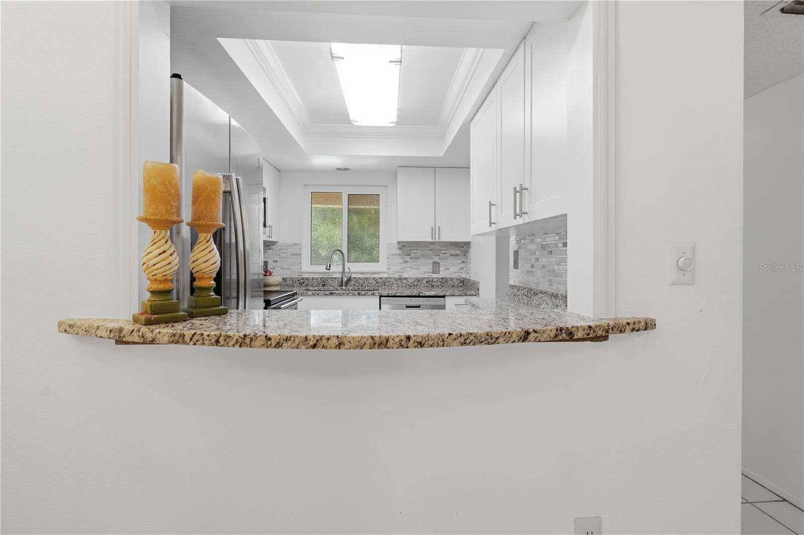 Looking from dining to kitchen - 2448 CLUBHOUSE DR #202, SARASOTA