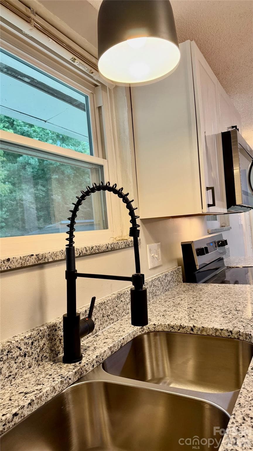 new faucet, light and granite on window sill perfect for plants. - 216 Auten Circle, Mount Holly