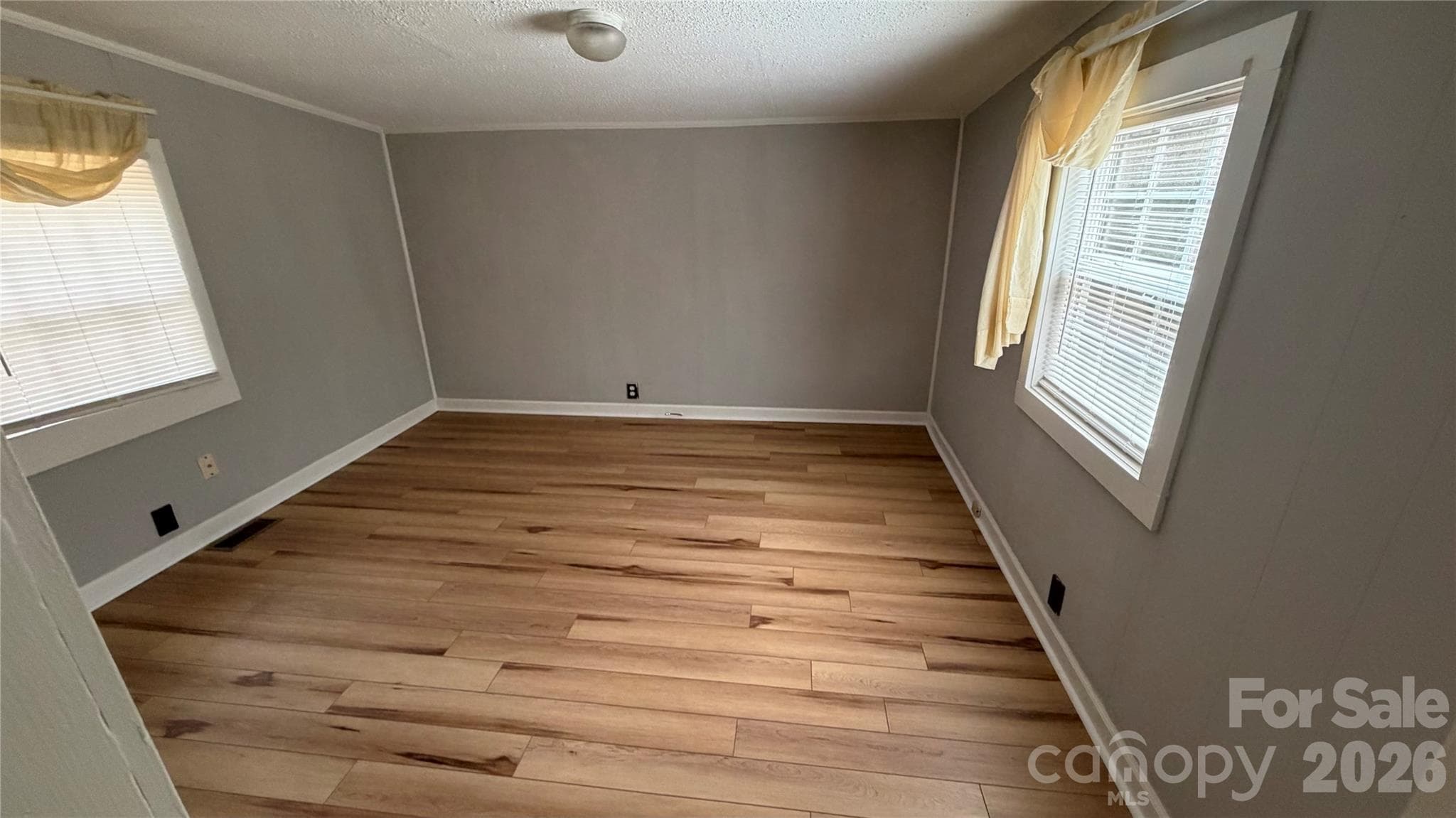 back bedroom has sloping lower ceilings. New LVP flooring - 216 Auten Circle, Mount Holly