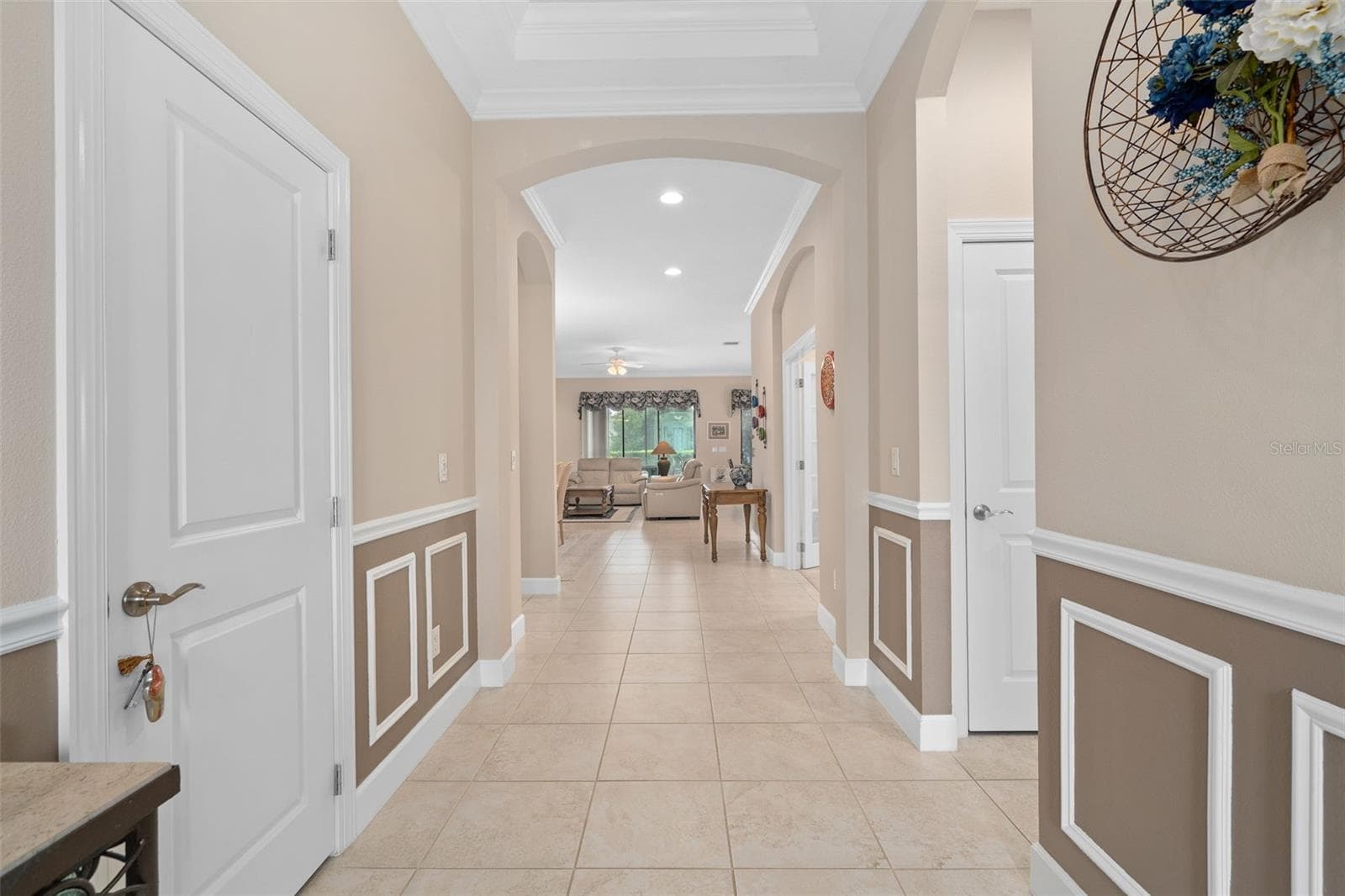 Foyer with Wainscoting leads to a See Through Floor Plan - 1197 ESPERANZA RIDGE RD, CLERMONT