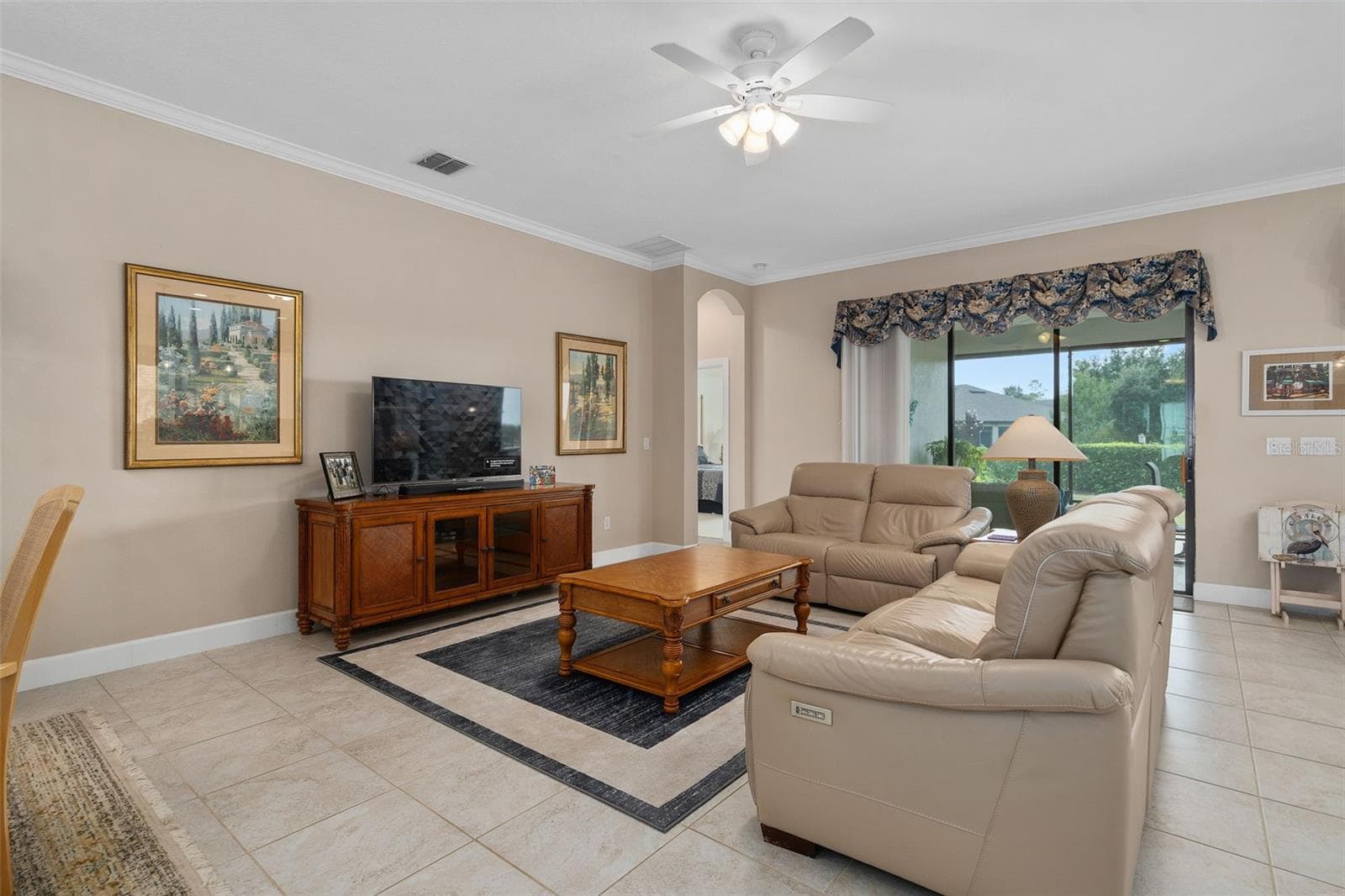 Family Room with a View to the Lanai and the Rear Yard with an Open Space View - 1197 ESPERANZA RIDGE RD, CLERMONT
