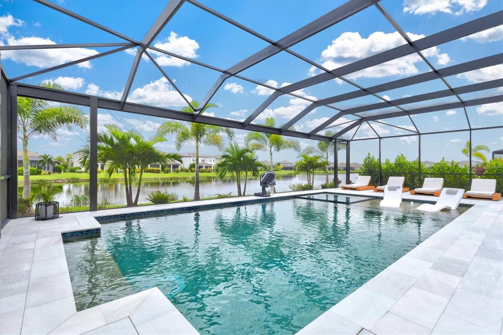 Extended lanai with pool and spa - 9297 TEQUILA SUNRISE DR, SARASOTA