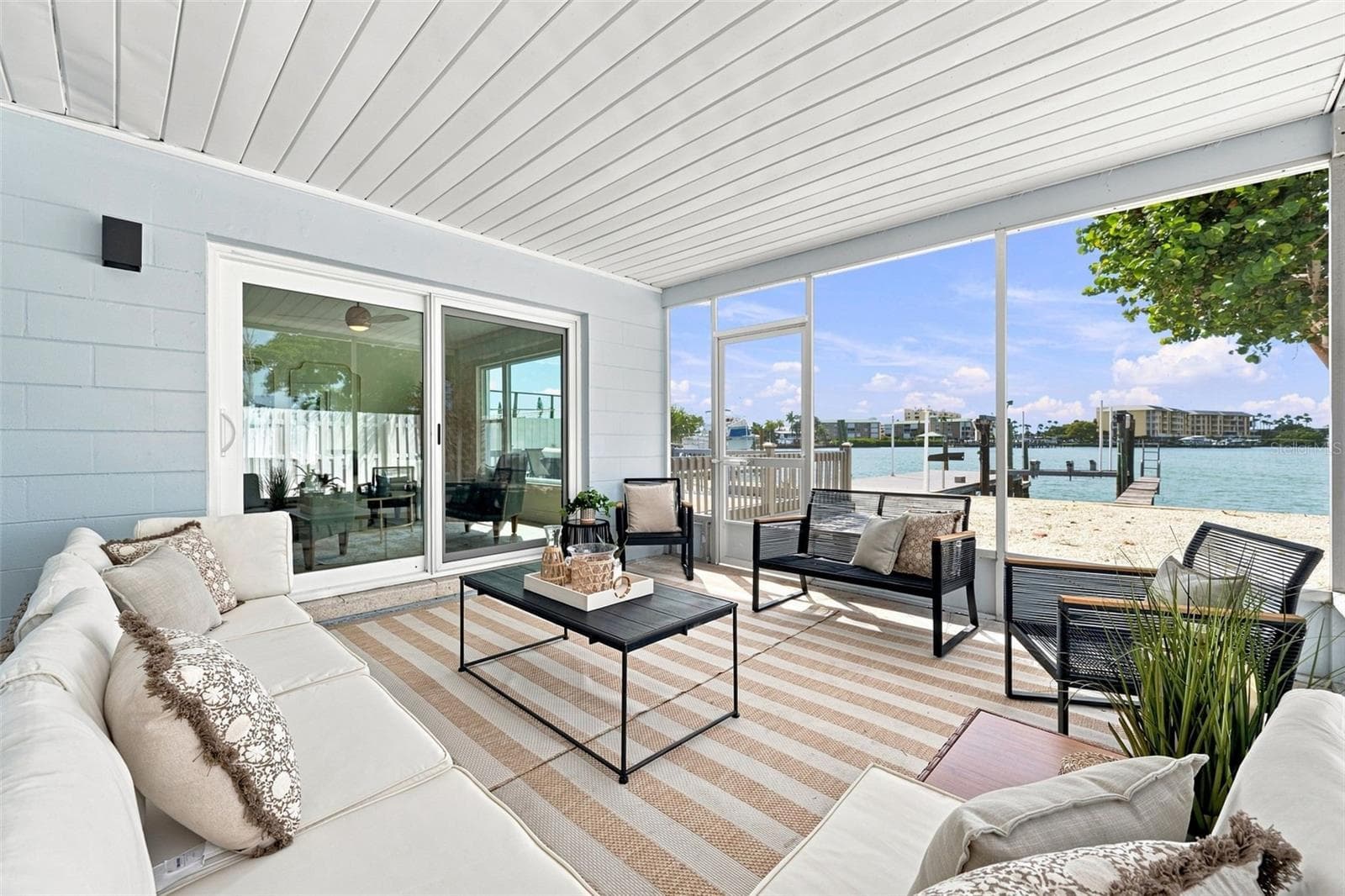 Covered and screened patio will be great for entertaining or just enjoying in solitude. - 360 145TH AVE E, MADEIRA BEACH